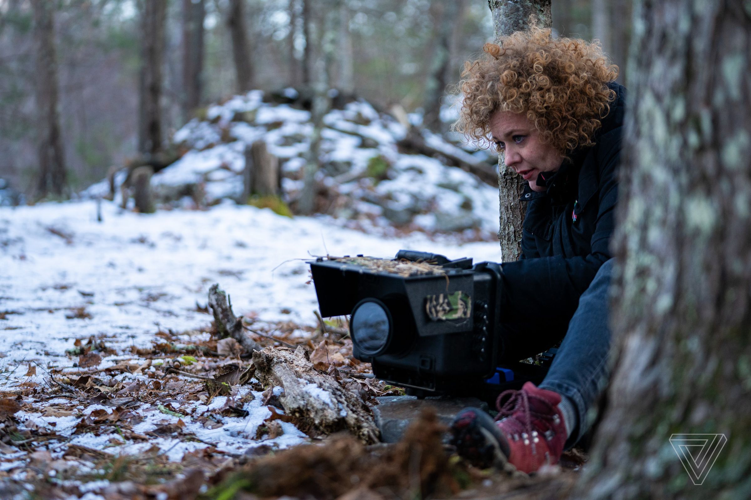 Carla Rhodes setting her camera trapping box.