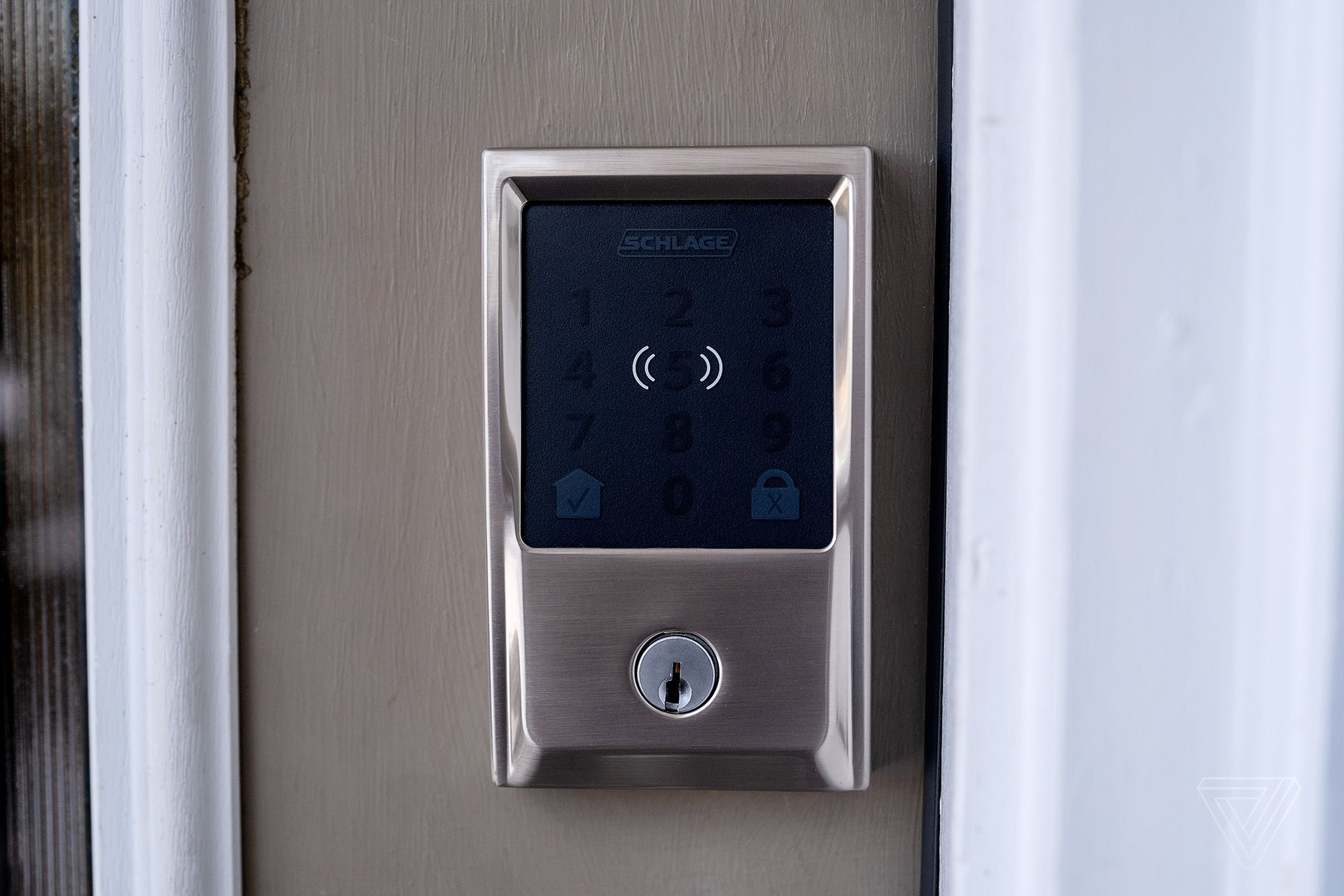 A close up of a touchscreen door lock