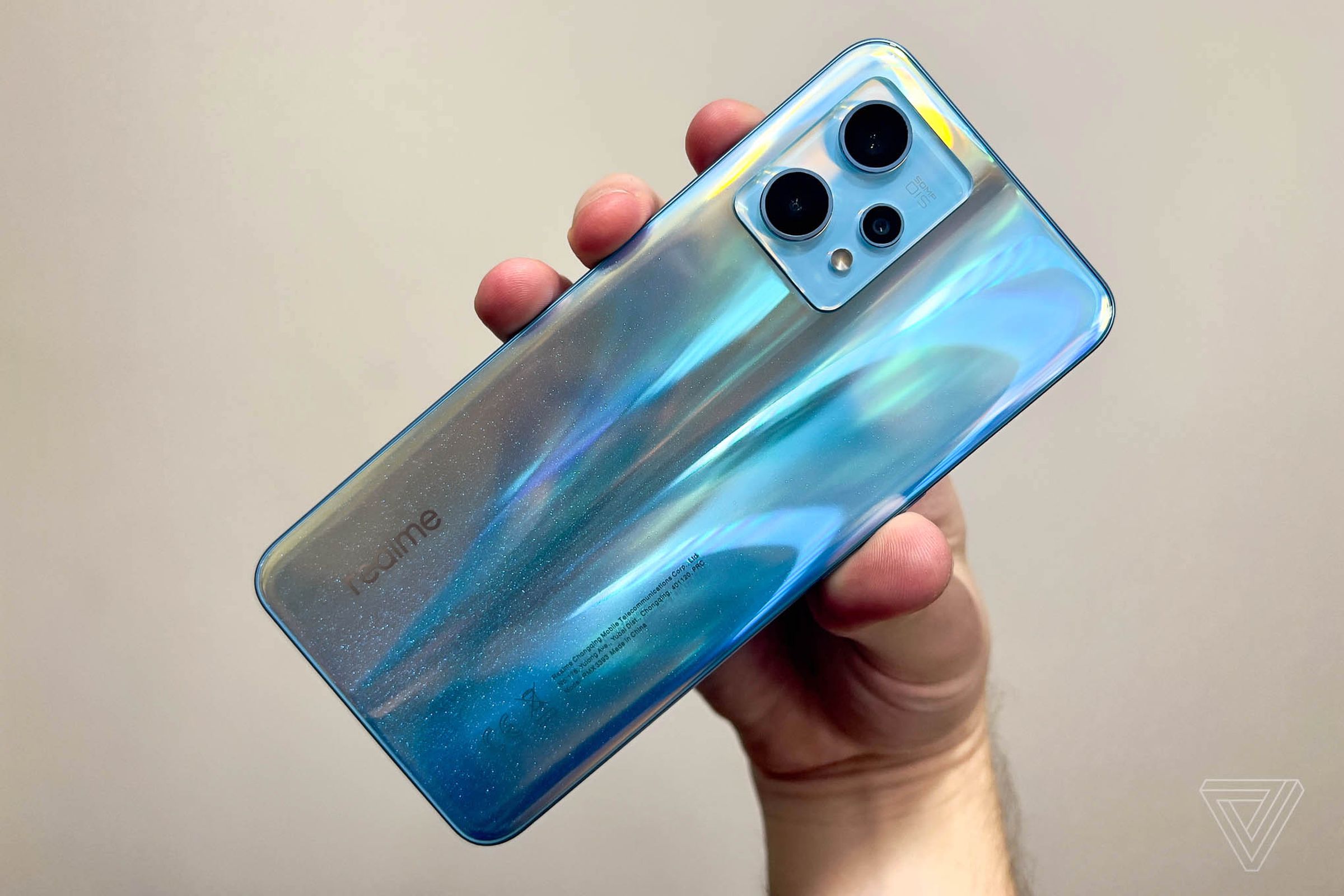 This is the same phone as the one in the first image. It’s blue until you take it outside.