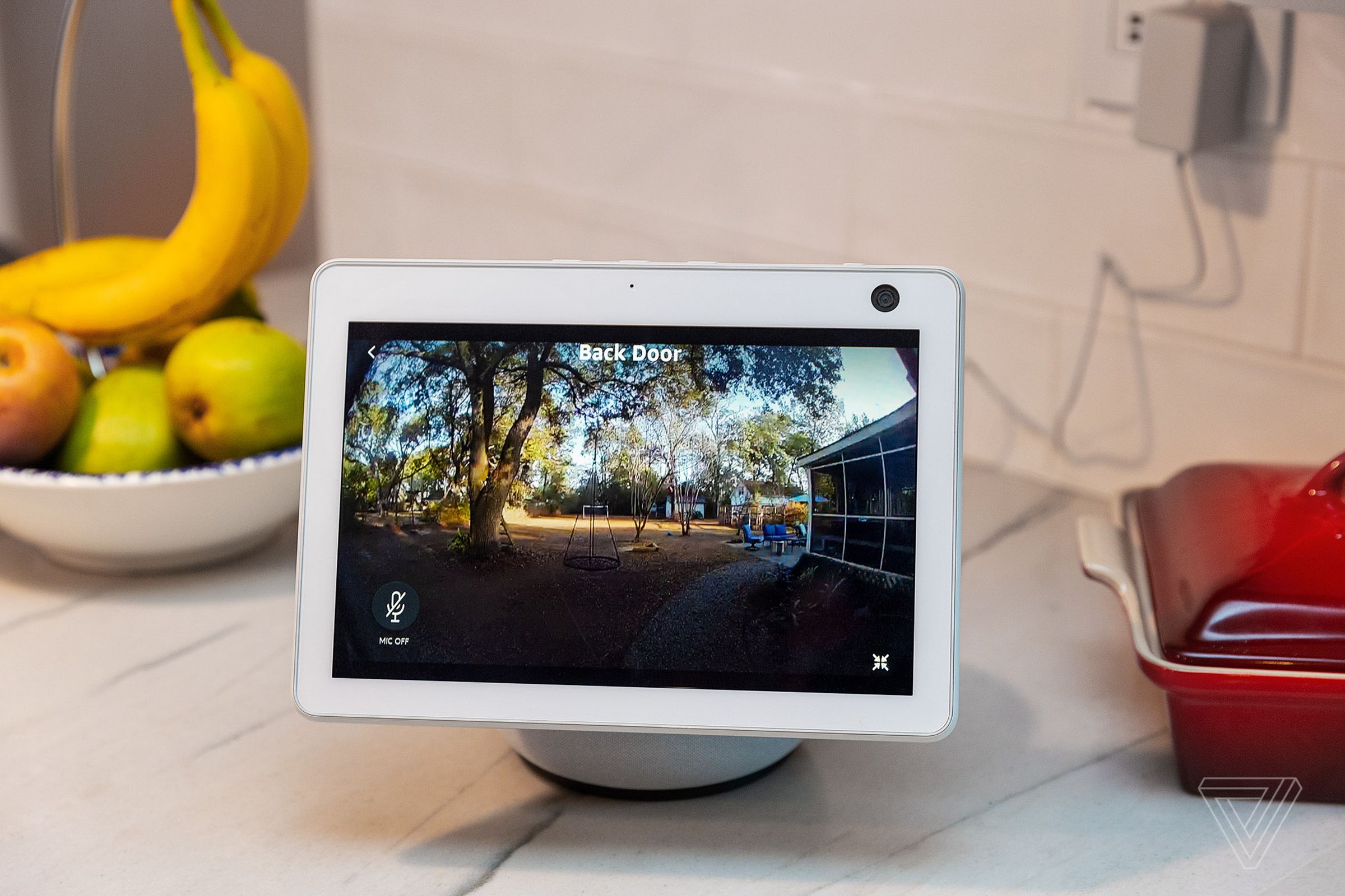 An Echo Show 10 with a live view of the Ring Video Doorbell 4. The microphone in the bottom left corner indicates you can talk to a visitor through the display.