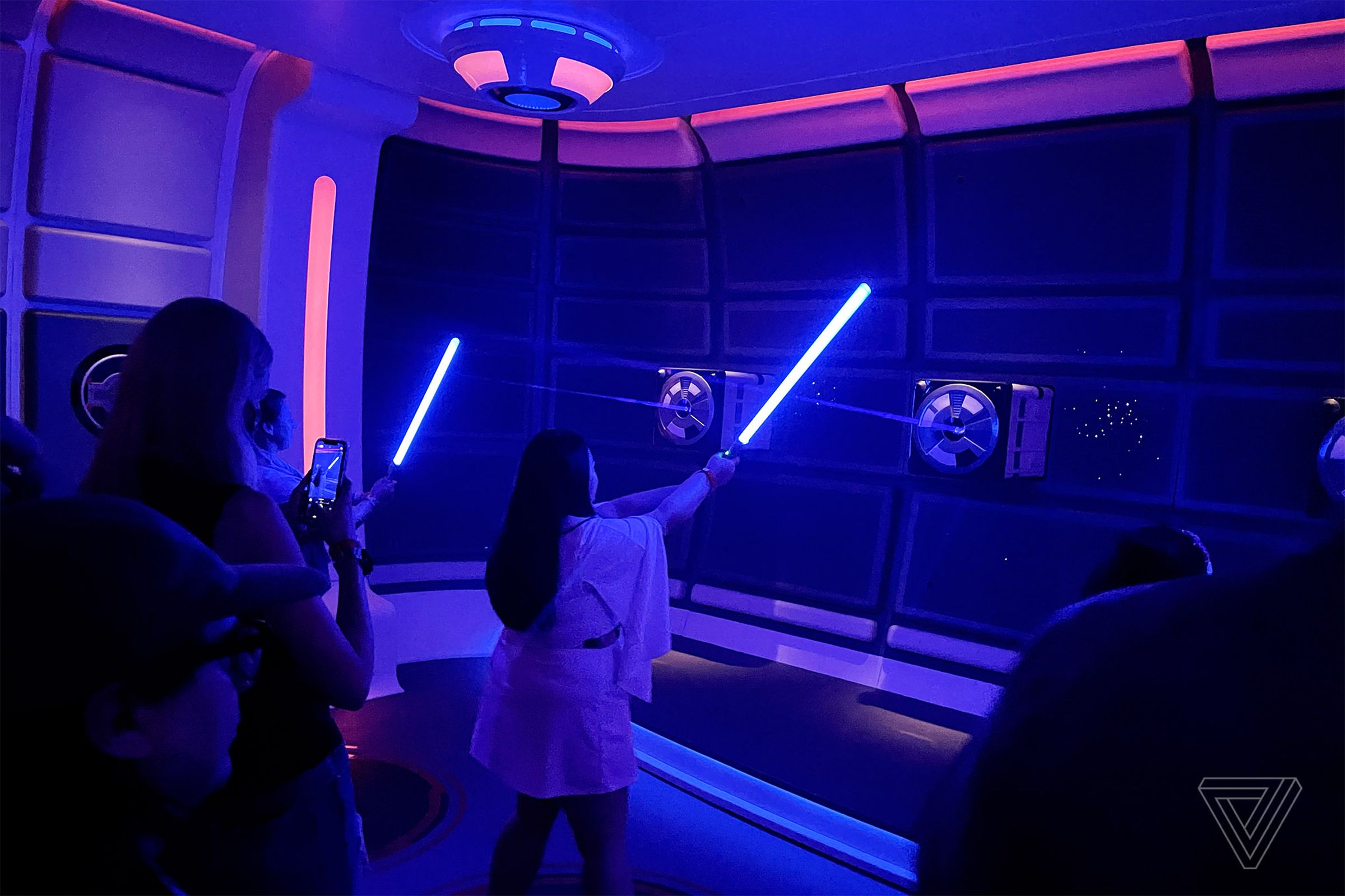 Learning the ways of the Jedi in the ship’s lightsaber training pod activity.