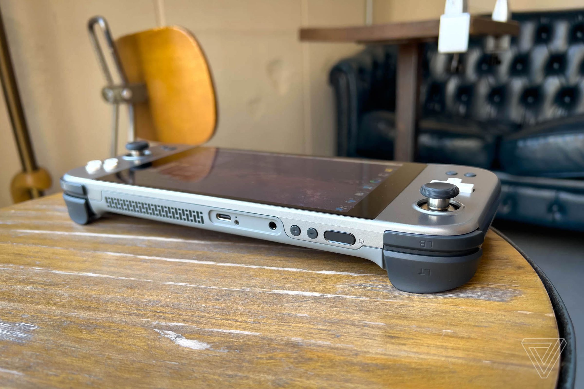There’s a USB-C port up top as well as on the bottom. You’ll also see the headphone jack, volume buttons, fan exhaust, and sleep/wake button with an integrated fingerprint sensor.