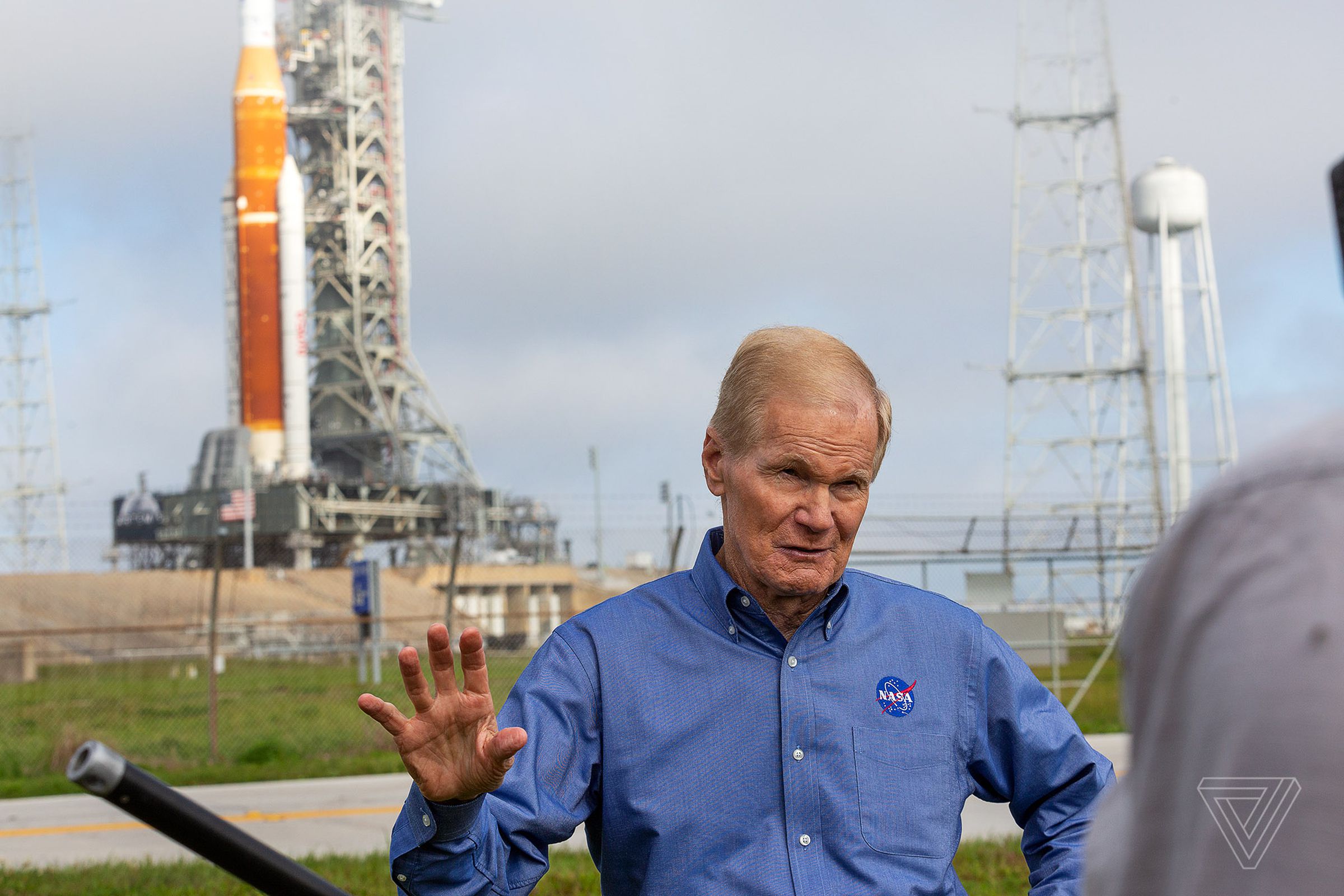NASA administrator Bill Nelson, with SLS in the background