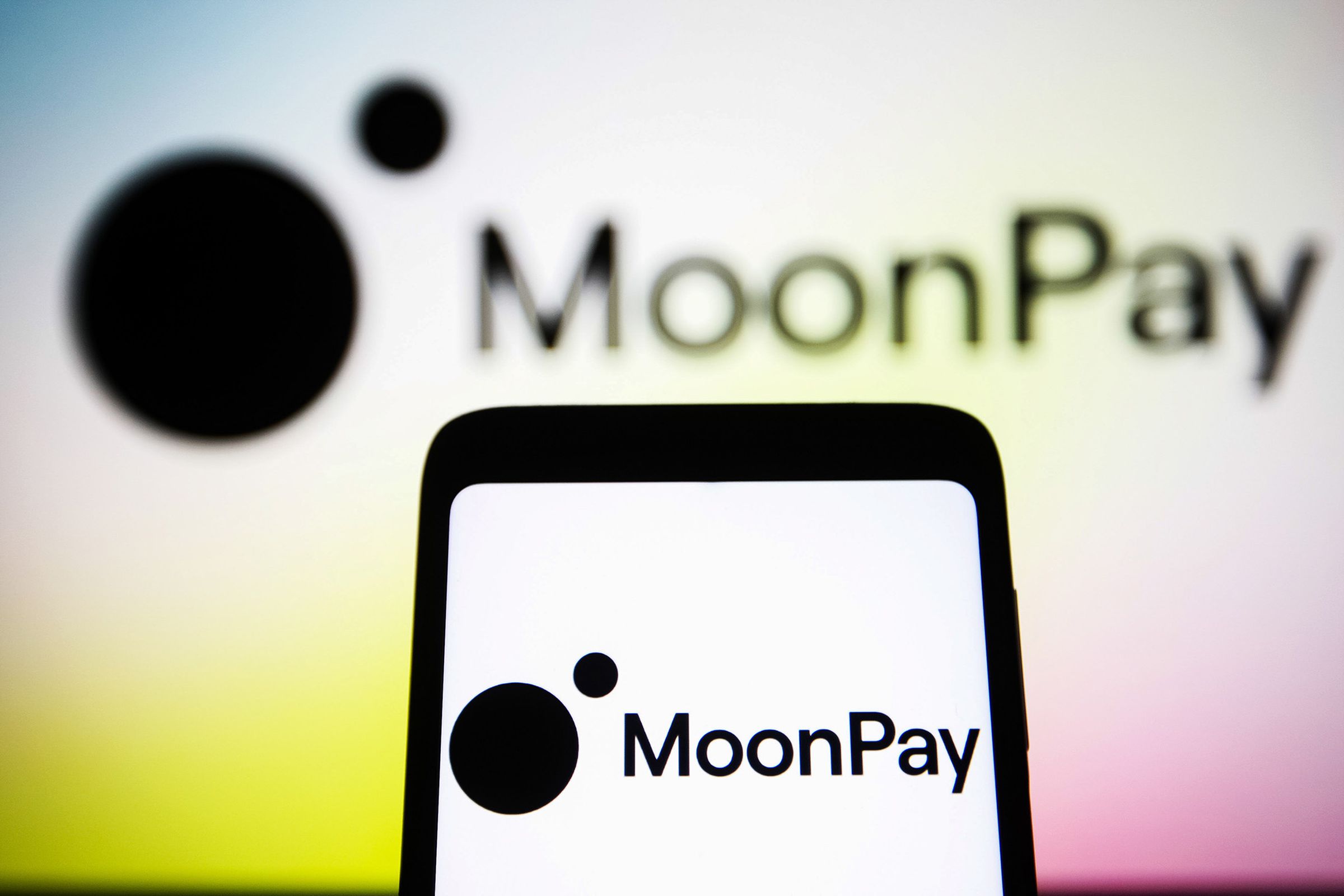 UKRAINE - 2021/11/22: In this photo illustration, the MoonPay logo is seen on a smartphone screen and in the background. (Photo Illustration by Pavlo Gonchar/SOPA Images/LightRocket via Getty Images)