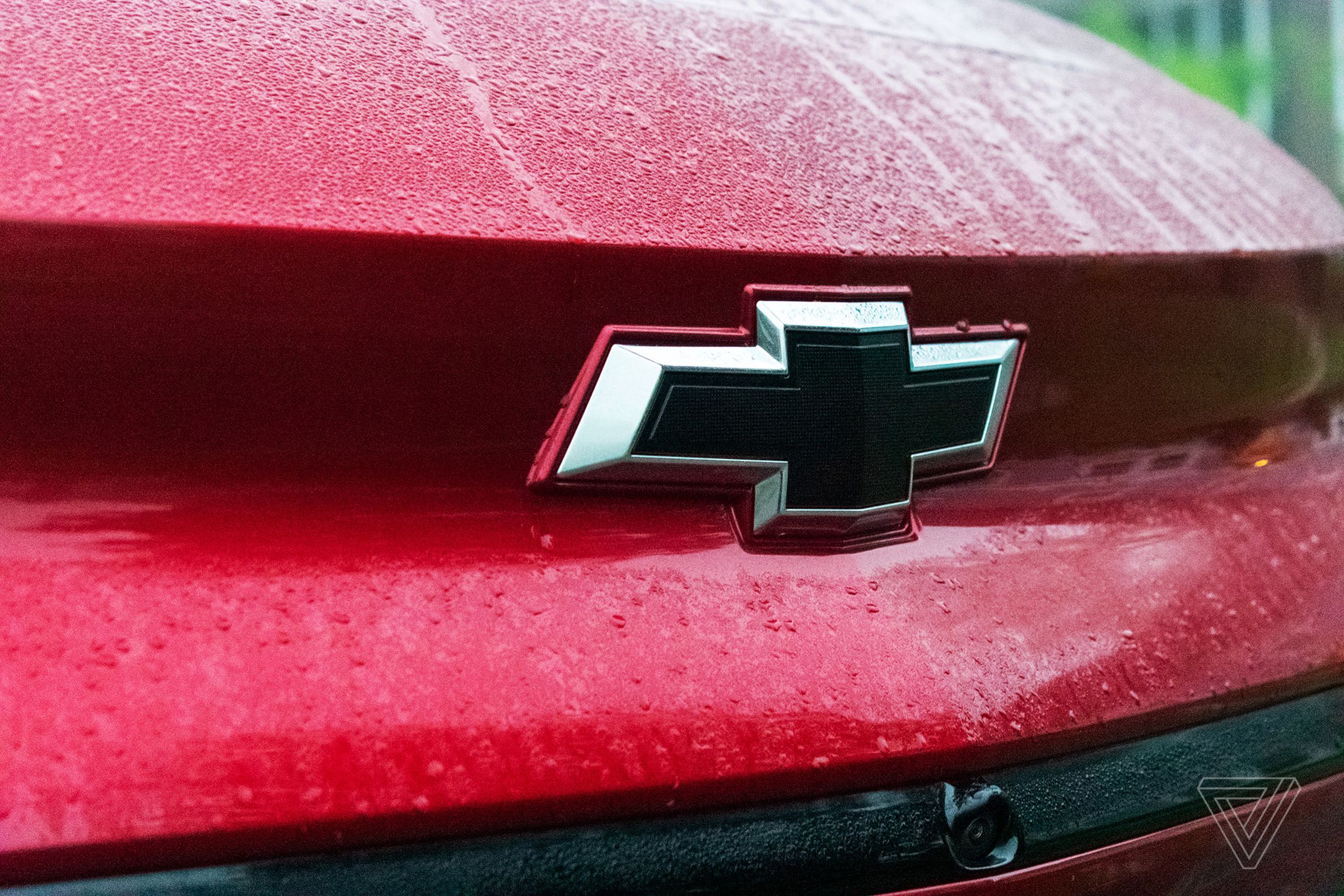 The Chevy logo on the front of a red vehicle
