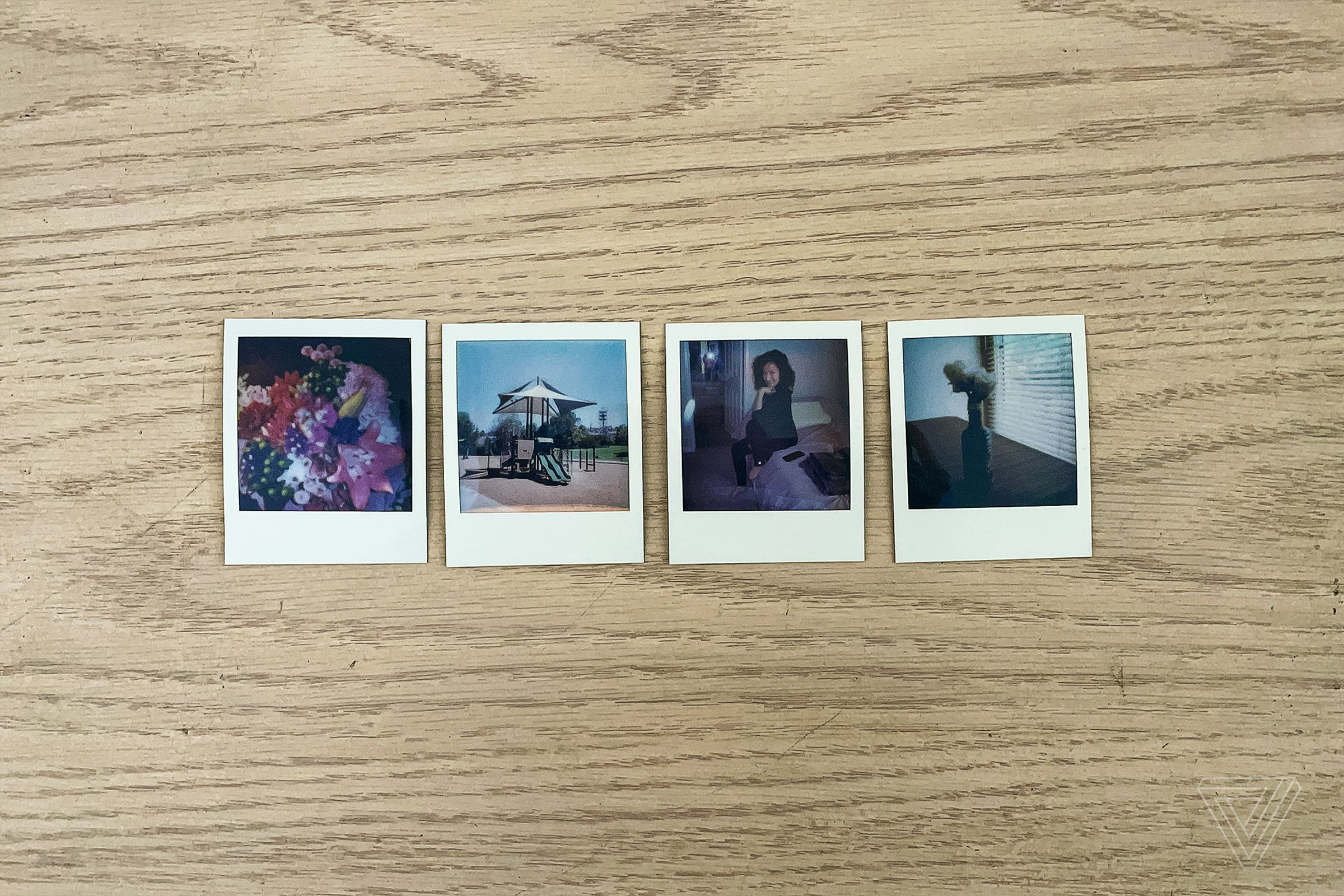 Four tiny photos produced by the Polaroid Go.