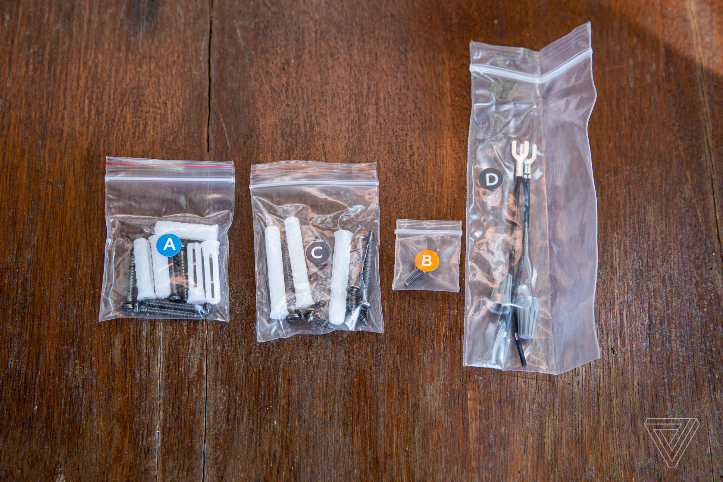 Ring provides everything you need to install the doorbell except a drill. The screws and wires are marked with letters to help you select the right ones.