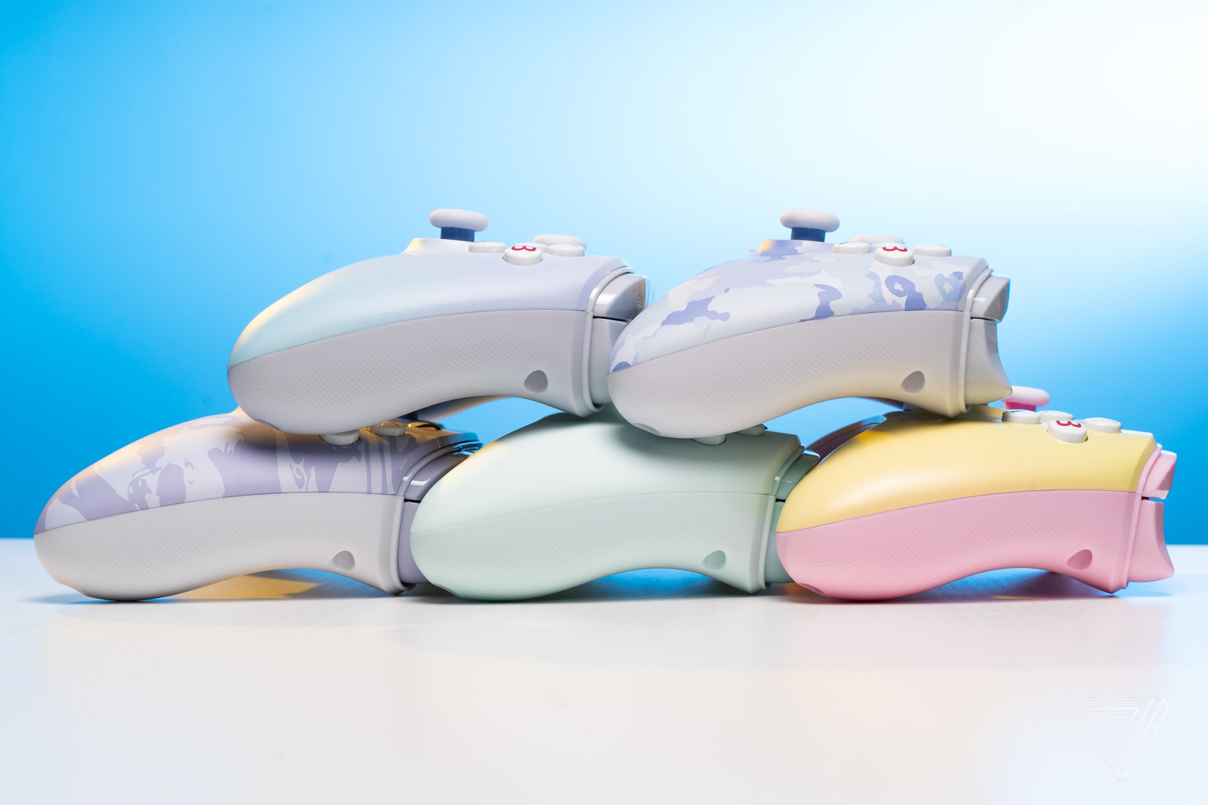 Side-profile image of all five PowerA Enhanced Wired pastel controllers.