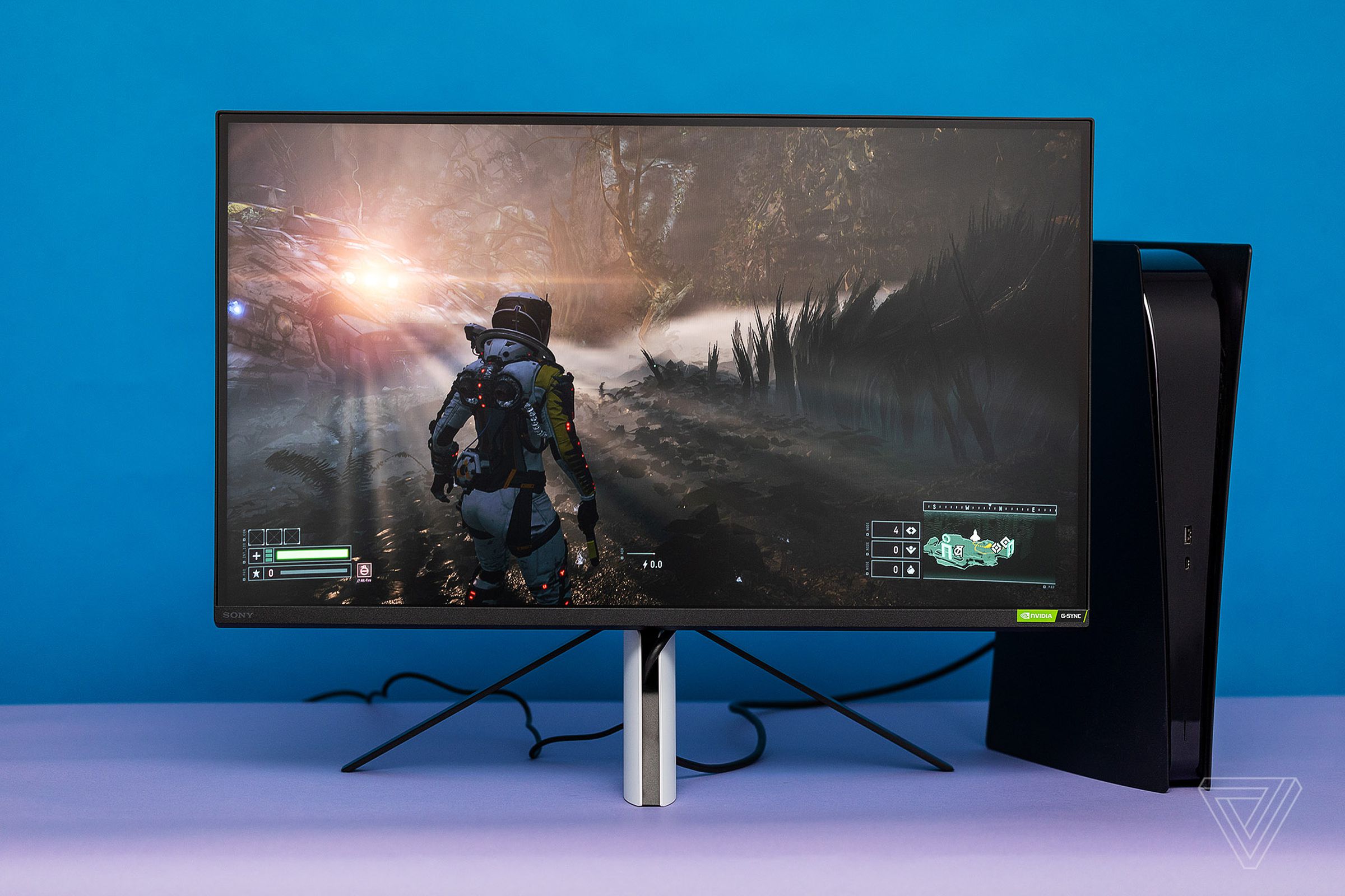 Sony InZone M9 gaming monitor displaying a scene from Returnal on PS5.