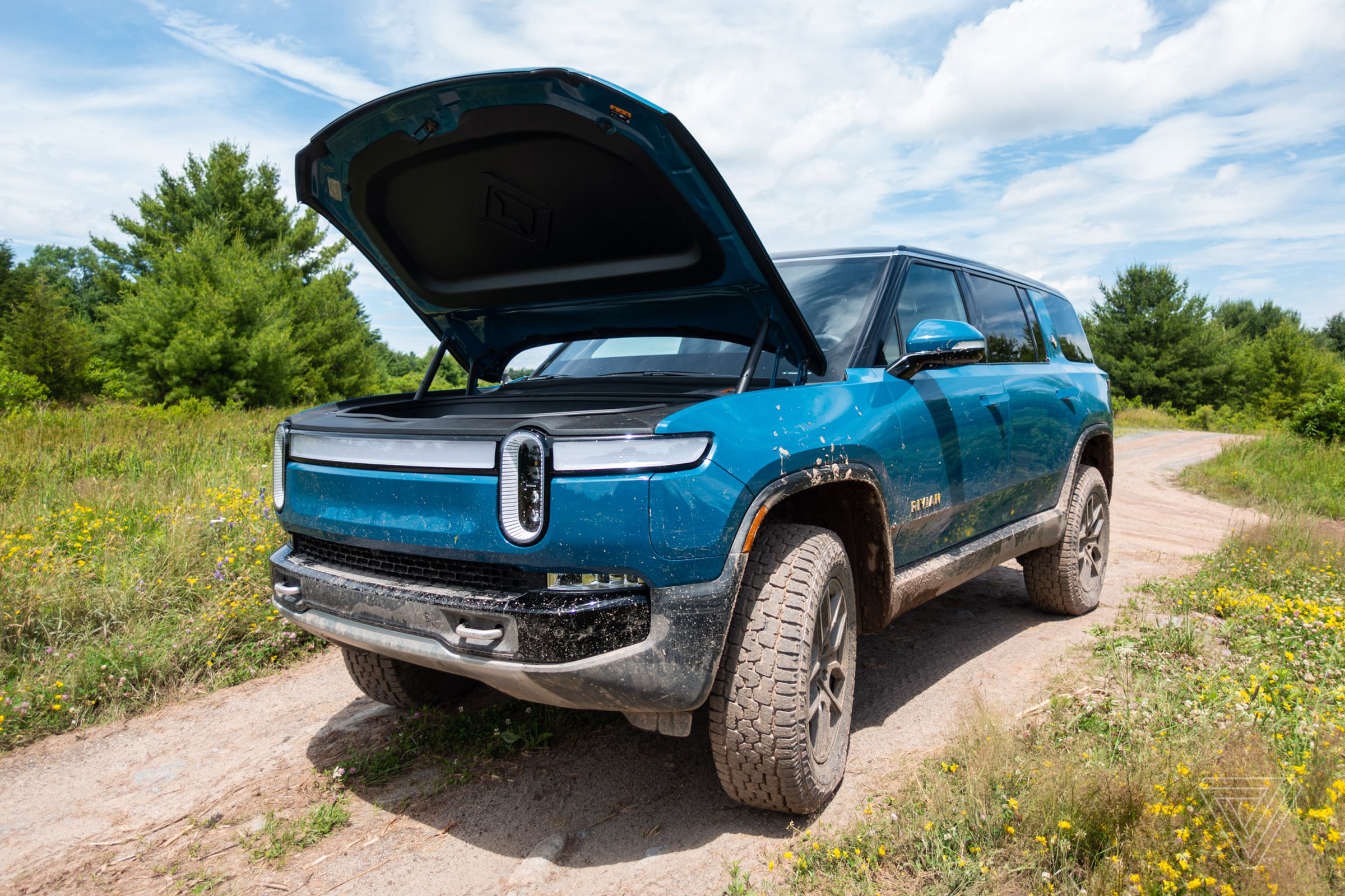 Blue Rivian R1S with the frunk open