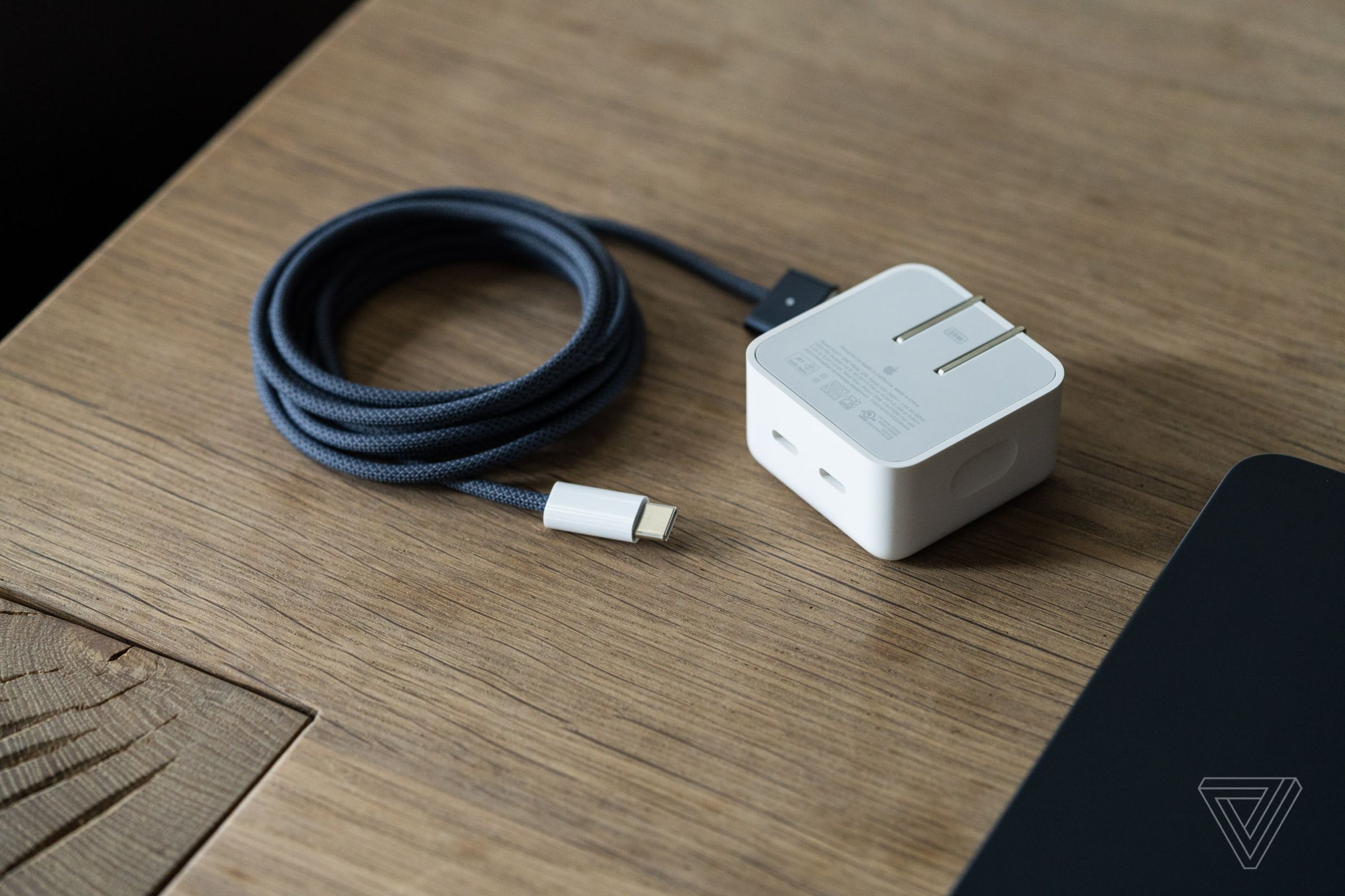 You have a choice between a smaller, slower 2-port charger or a larger, faster one-port charger on the upgraded Air models. Both come with a color-matched MagSafe cable.