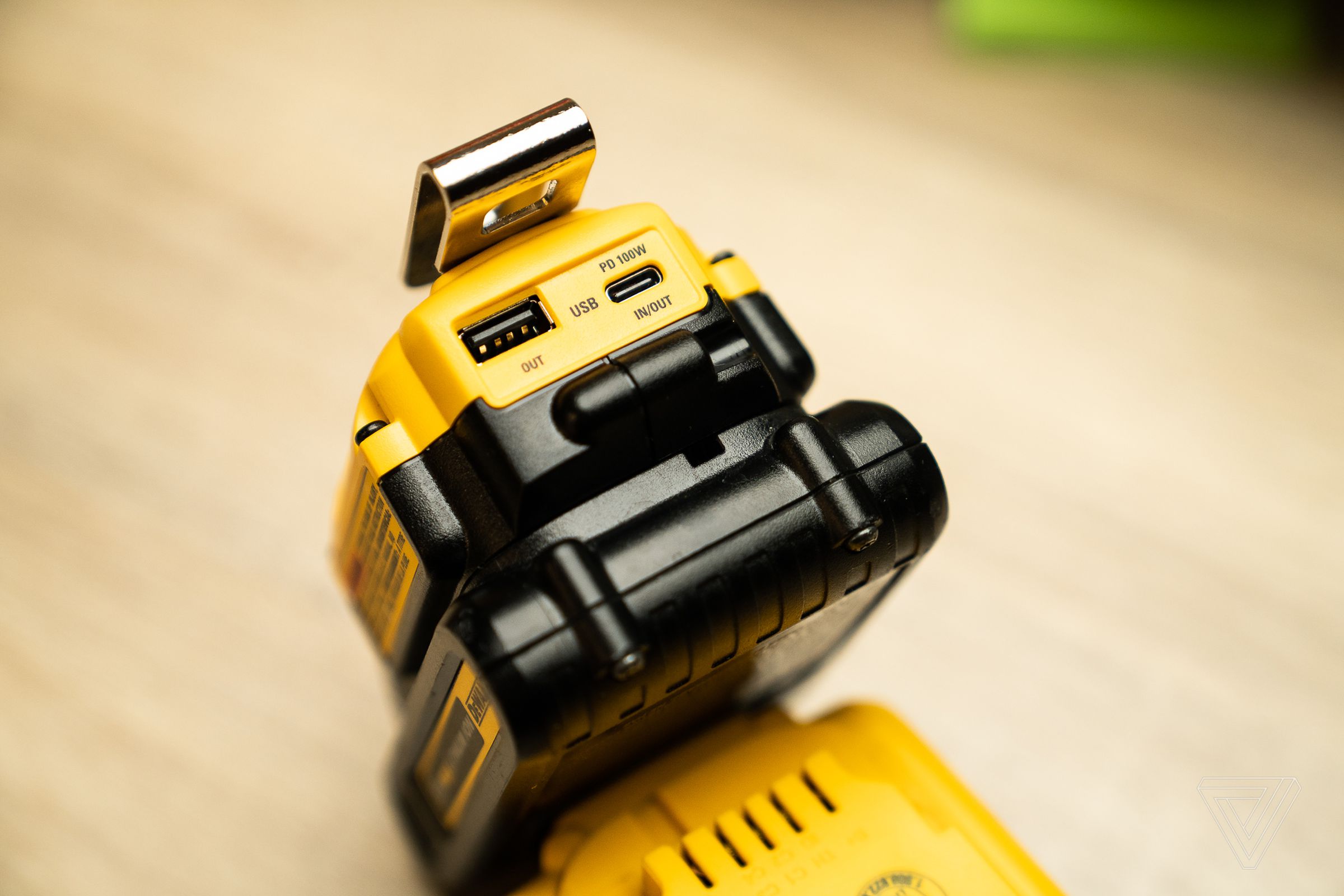 You get one 100W USB-C PD port, and one 12W USB-A port. The USB-A port will do passthrough charging while you’re charging the DeWalt battery, too.