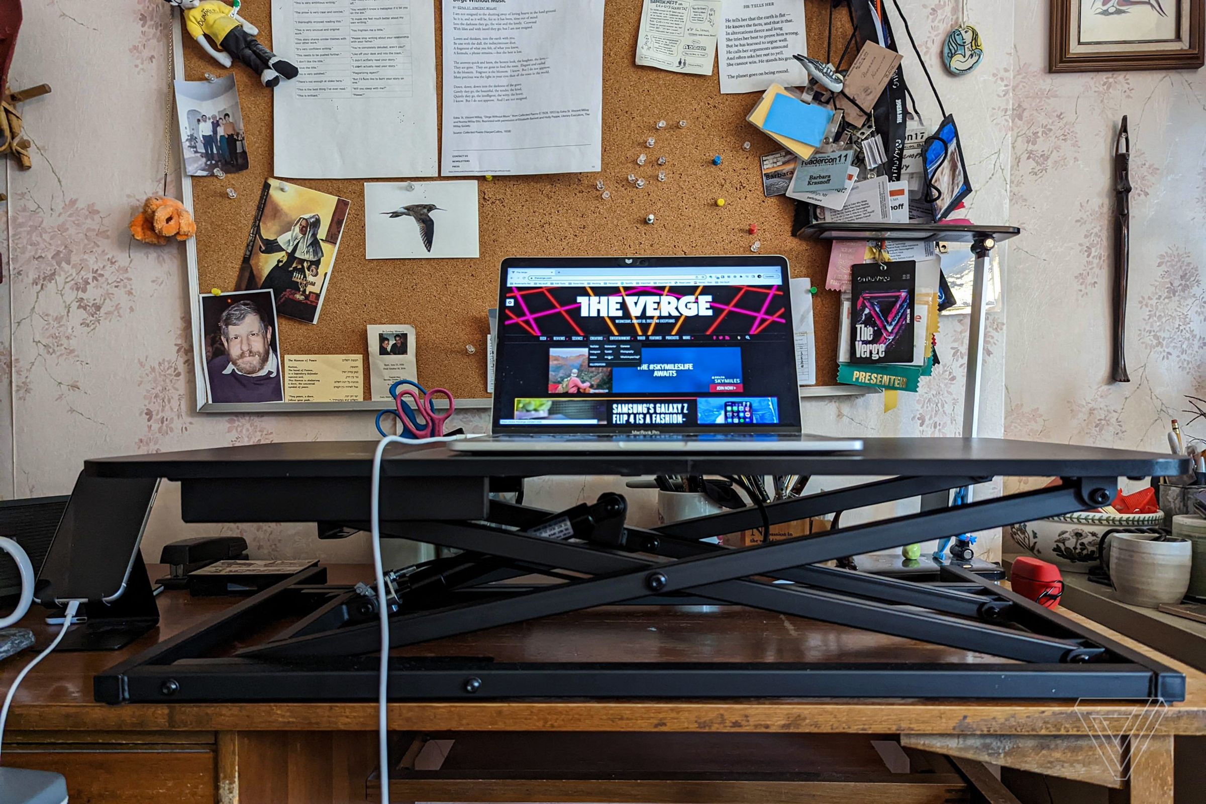 Laptop on desk converter on desk.