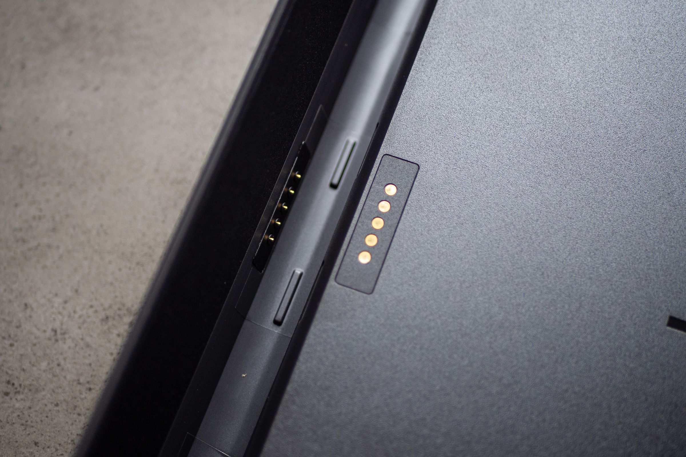 A close-up picture of the SecureConnect pogo pins on the rear of the Brydge SP Max Plus keyboard case.