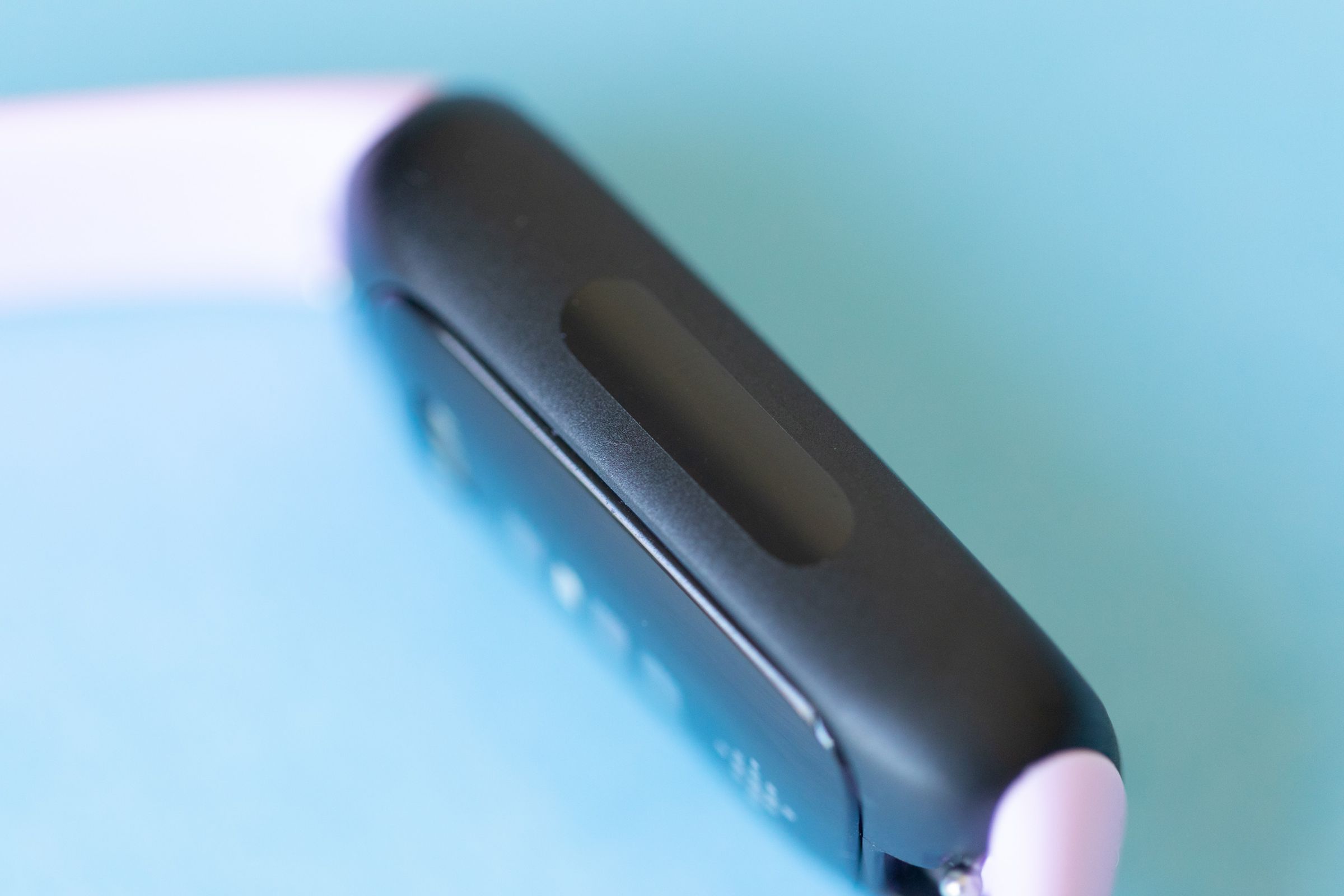 Closeup of inductive buttons on Fitbit Inspire 3