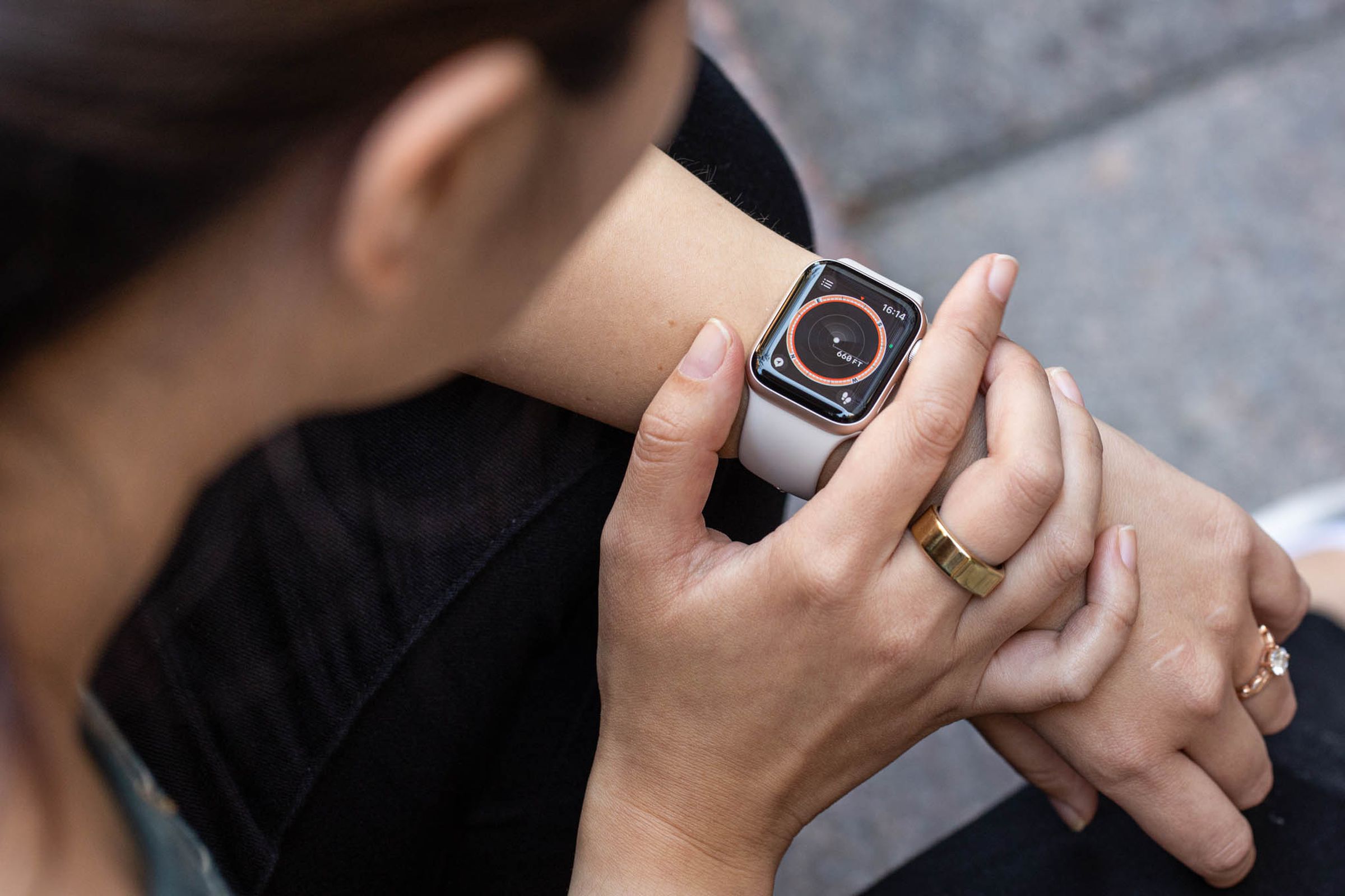 A person using an Apple Watch SE on their wrist.