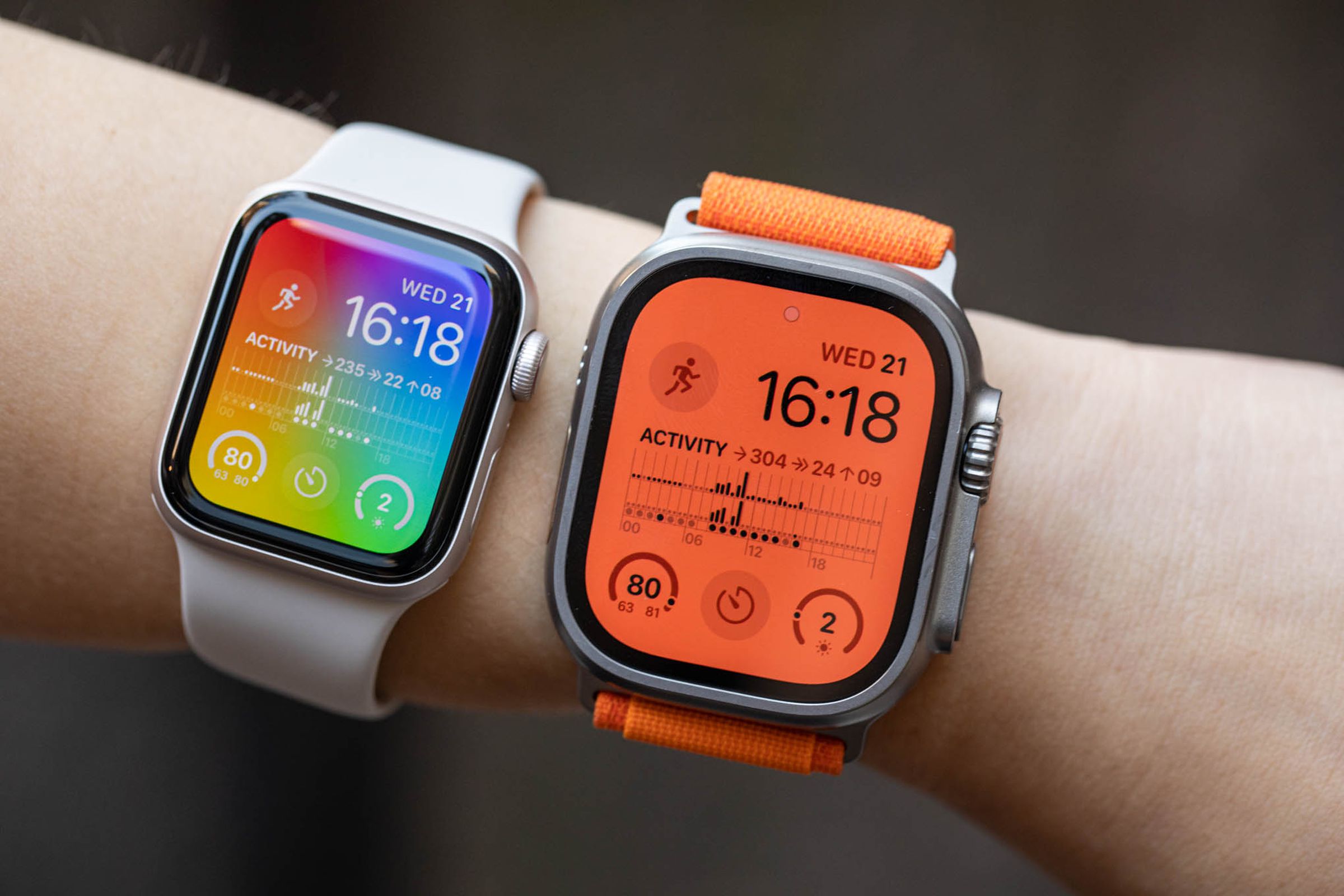The Apple Watch SE (2022) next to the Apple Watch Ultra on a woman’s arm