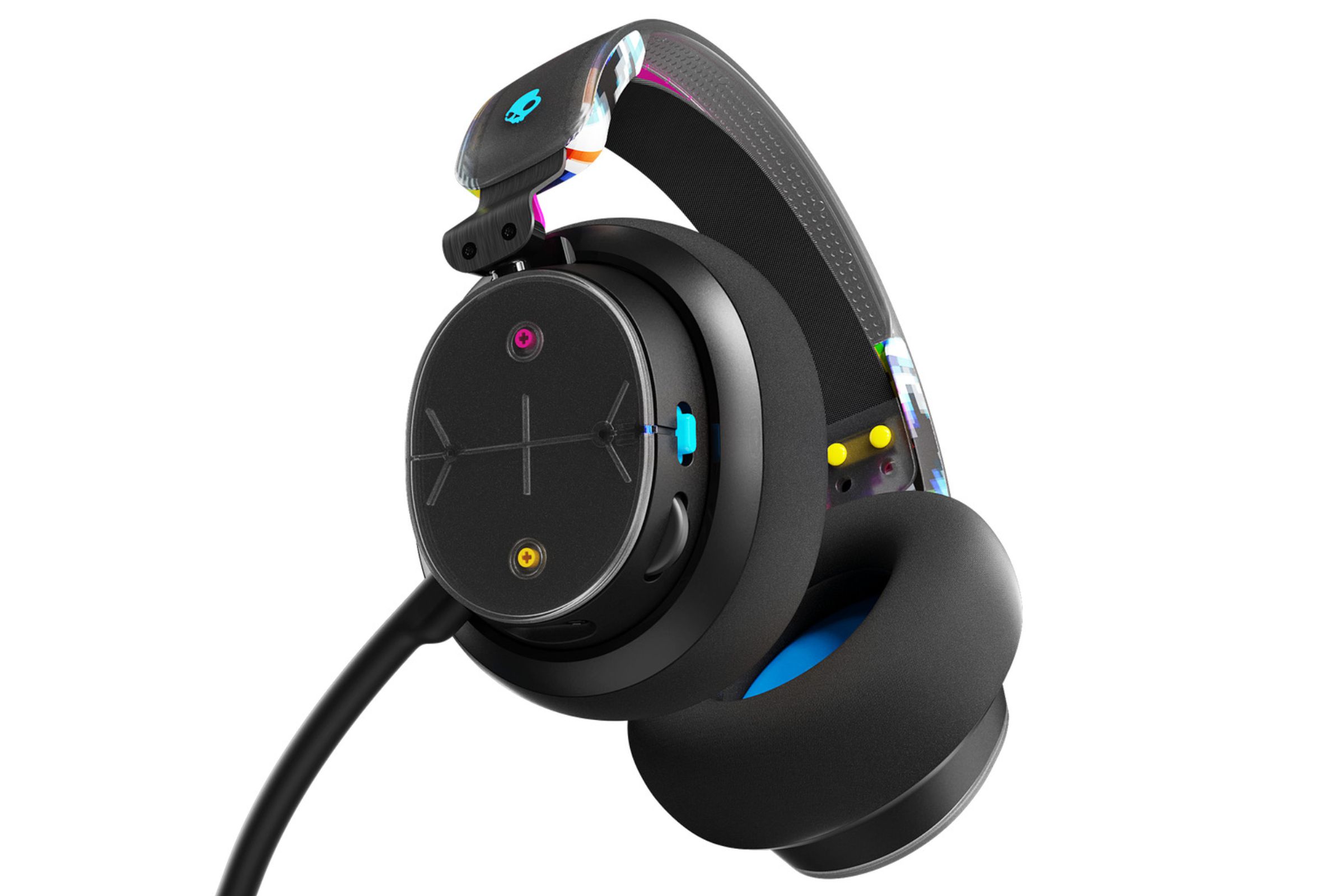 Skullcandy PLYR wireless gamign headset angled in such a way to reveal its power button, volume scroll wheel, and two buttons.