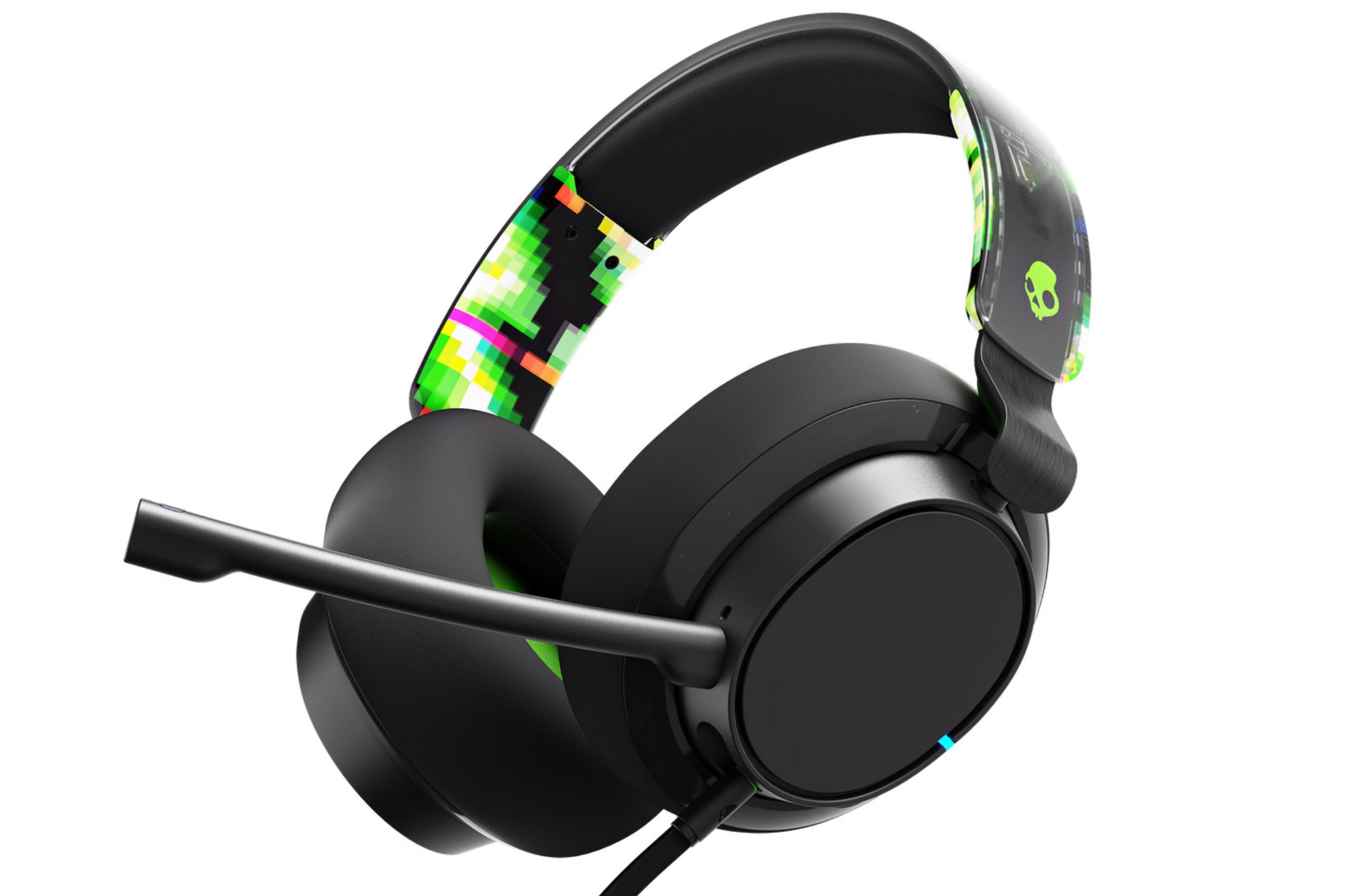 The Skullcandy SLYR Pro gaming headset is shown against a white backdrop. The headset is mostly black, with a few details that are neon green and pink.