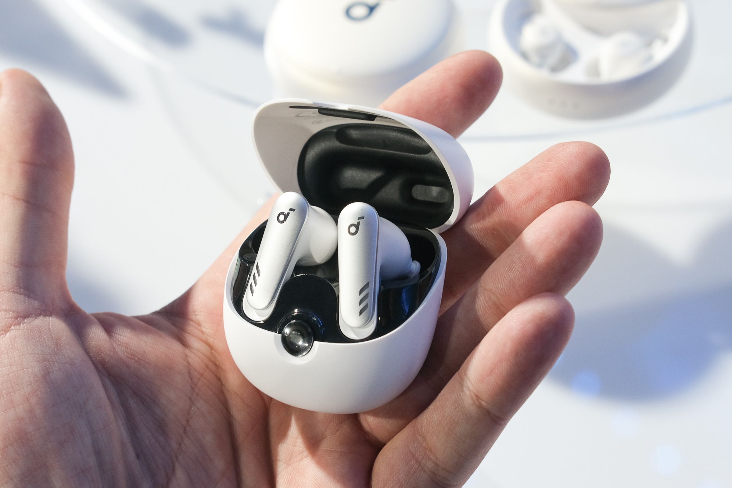 An image of Anker’s Soundcore VR P10 earbuds in a person’s hand.