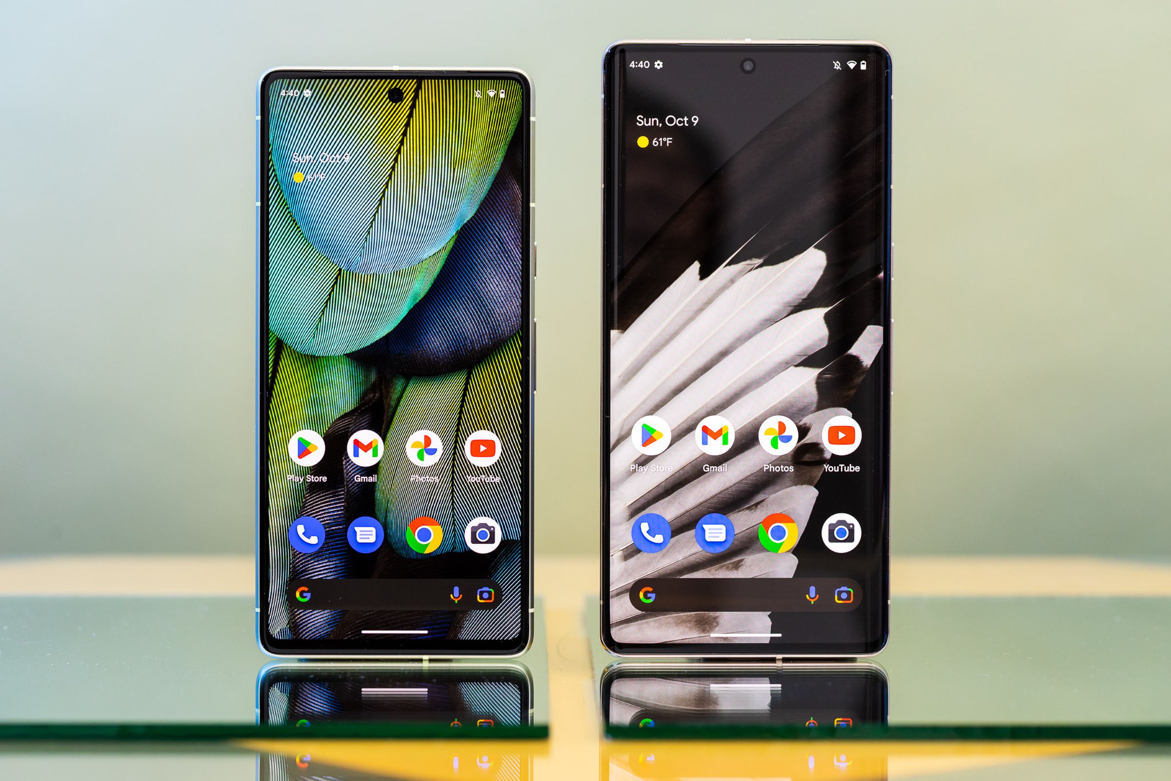 Pixel 7 and Pixel 7 Pro standing upright with screens on.