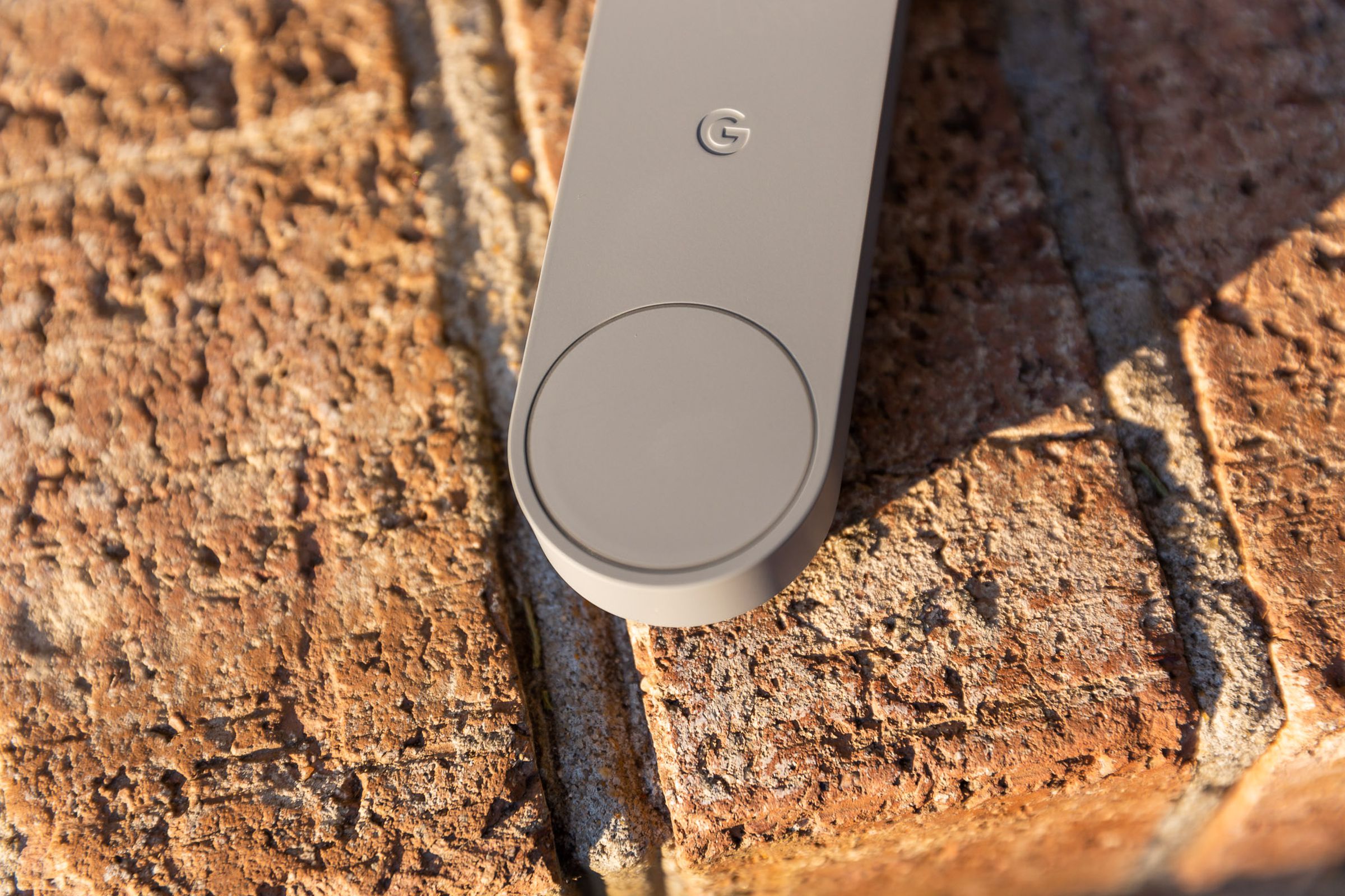 Close-up of the button at the bottom of the Nest doorbell