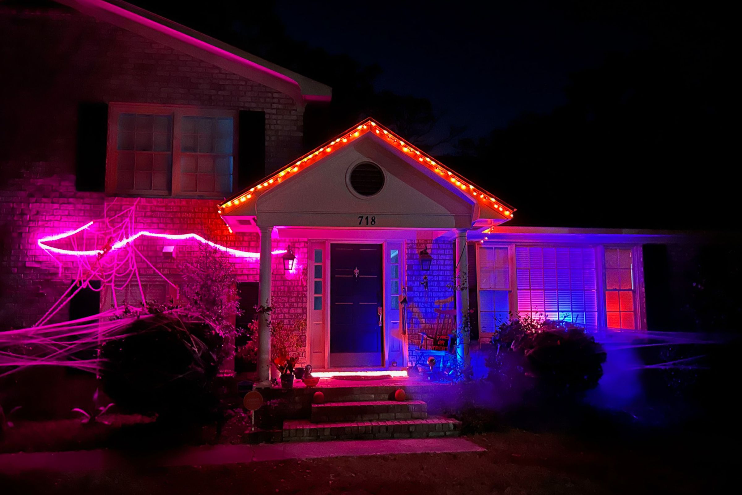 A house with multi-colored, spooky lighting