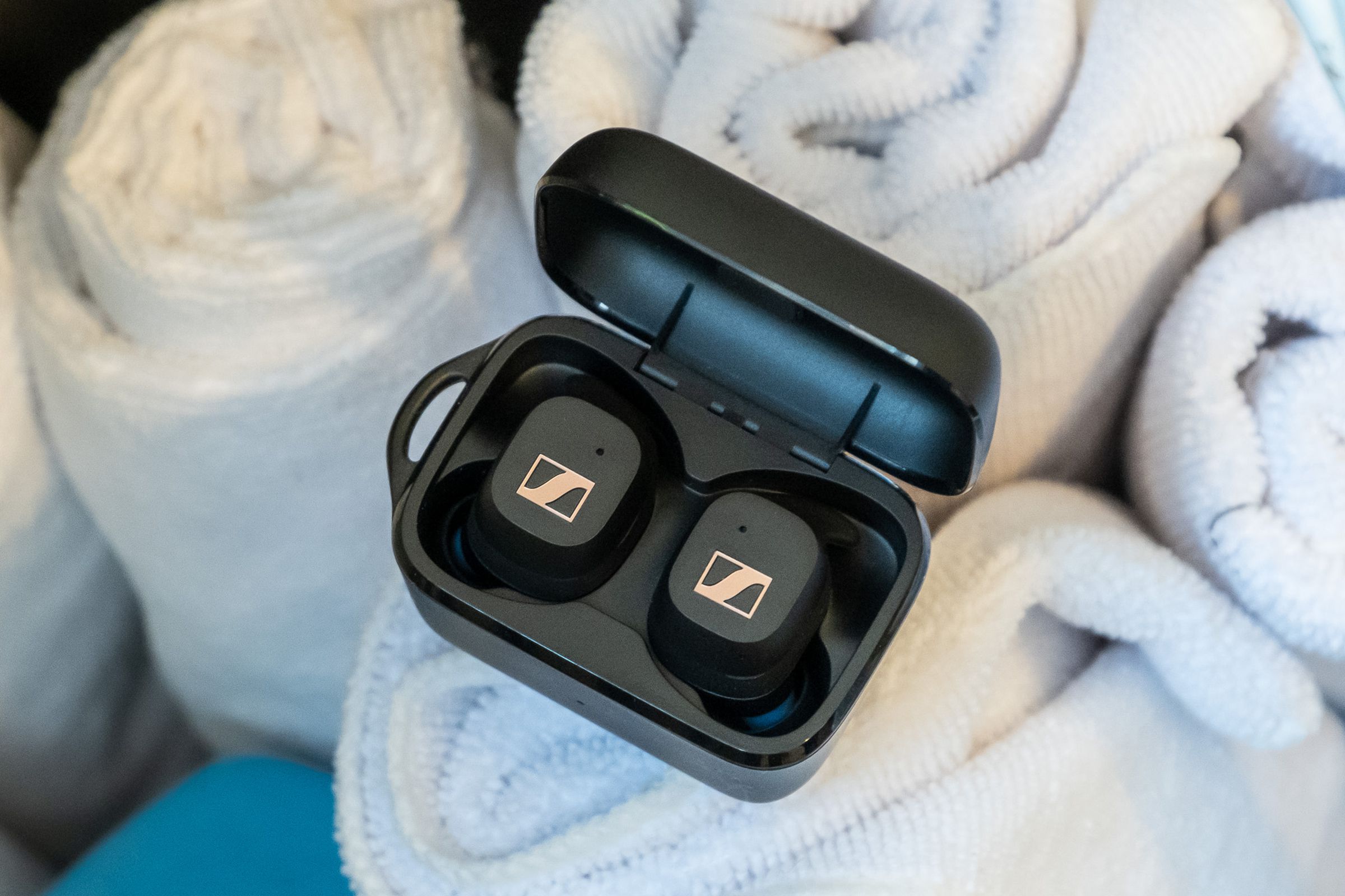 A photo of Sennheiser’s Sport Earbuds on several folded towels.