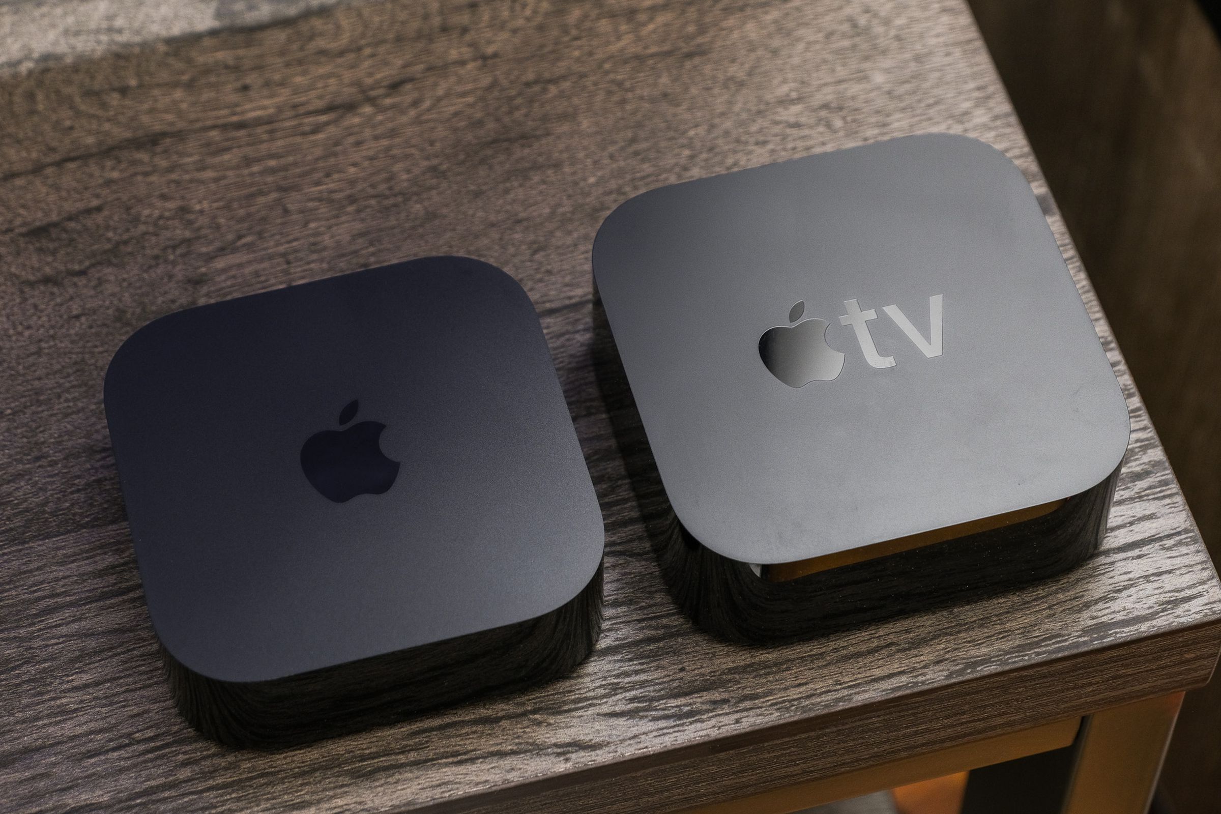 A comparison photo of the third-generation Apple TV 4K beside the second-generation Apple TV 4K.