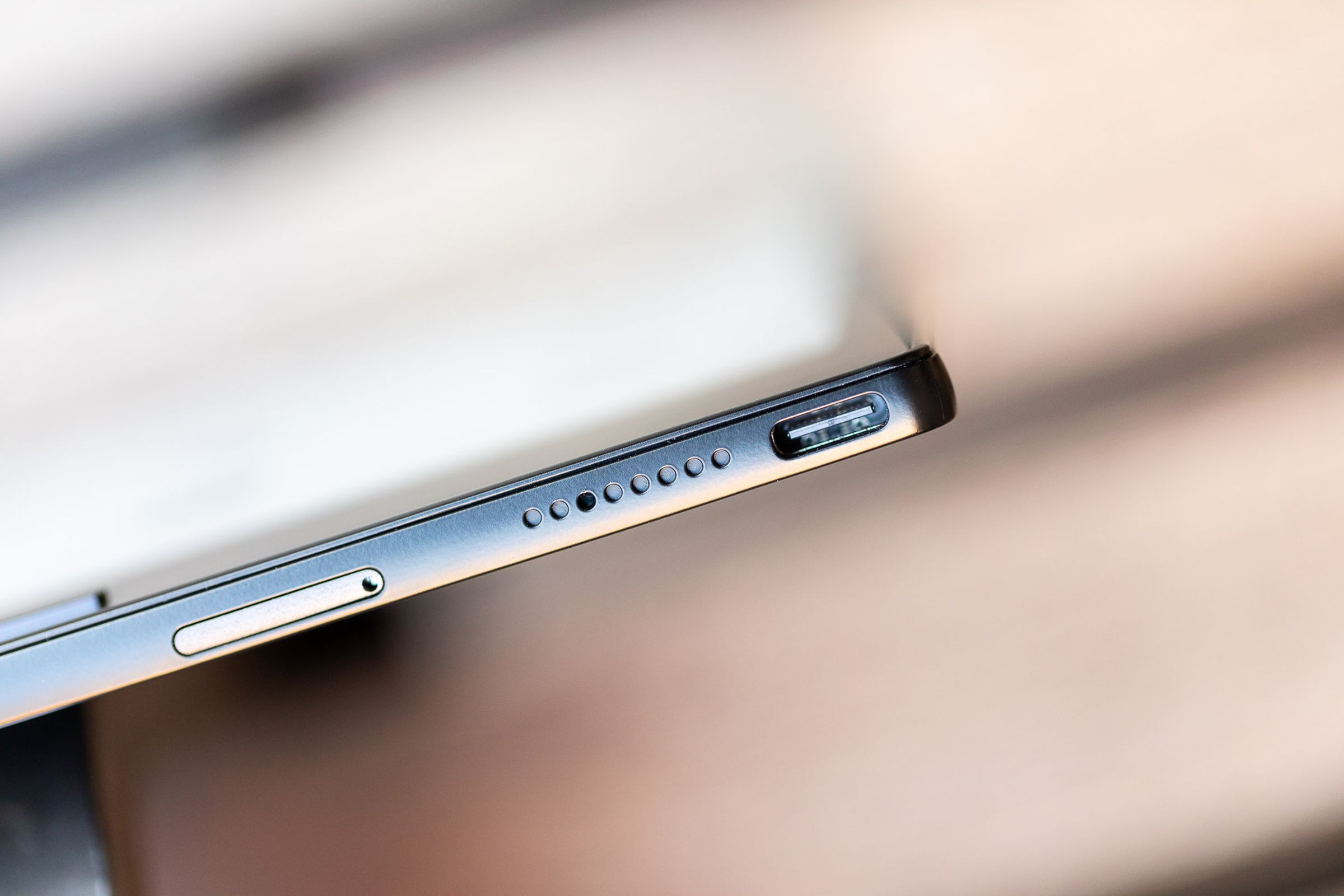 A close-up view of a microSD card slot, a speaker, and a USB-C port.