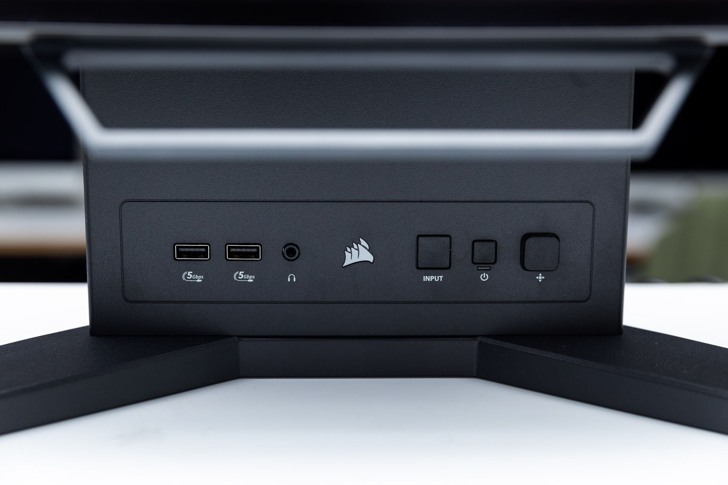 The front panel of buttons and ports on the Corsair Xeneon Flex OLED gaming monitor.