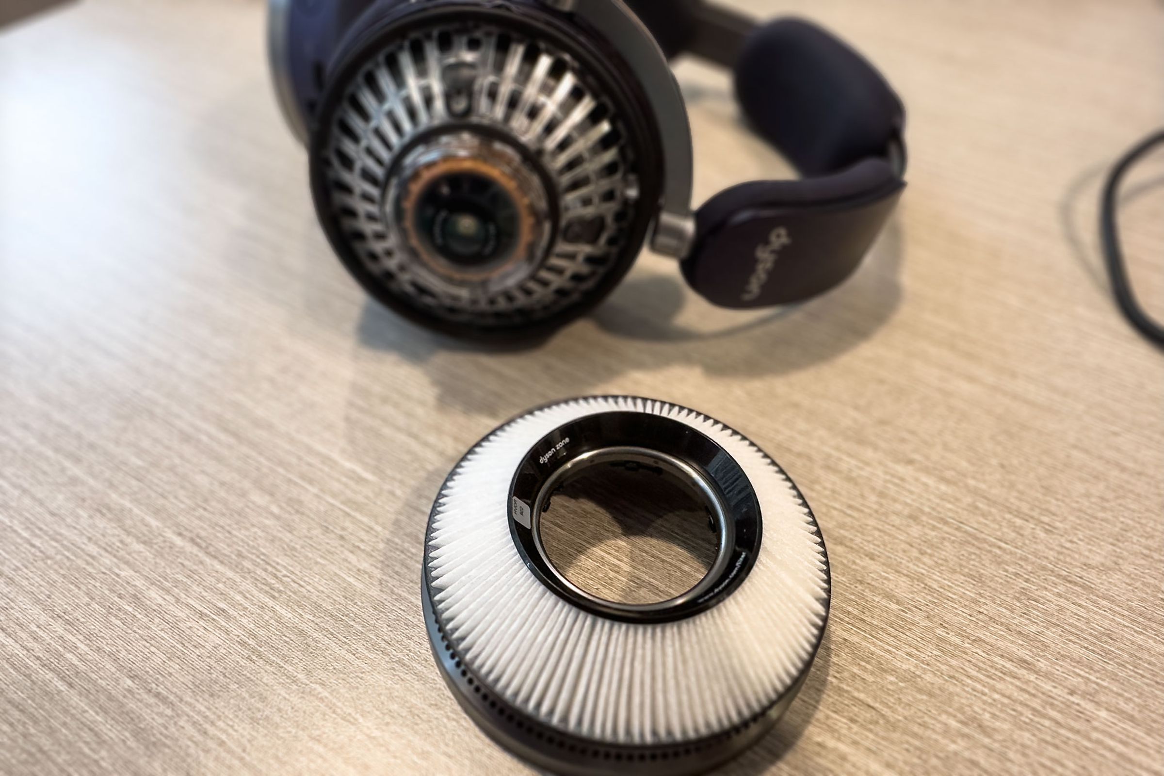 A close-up of the Dyson Zone’s filter with the headphones in the background