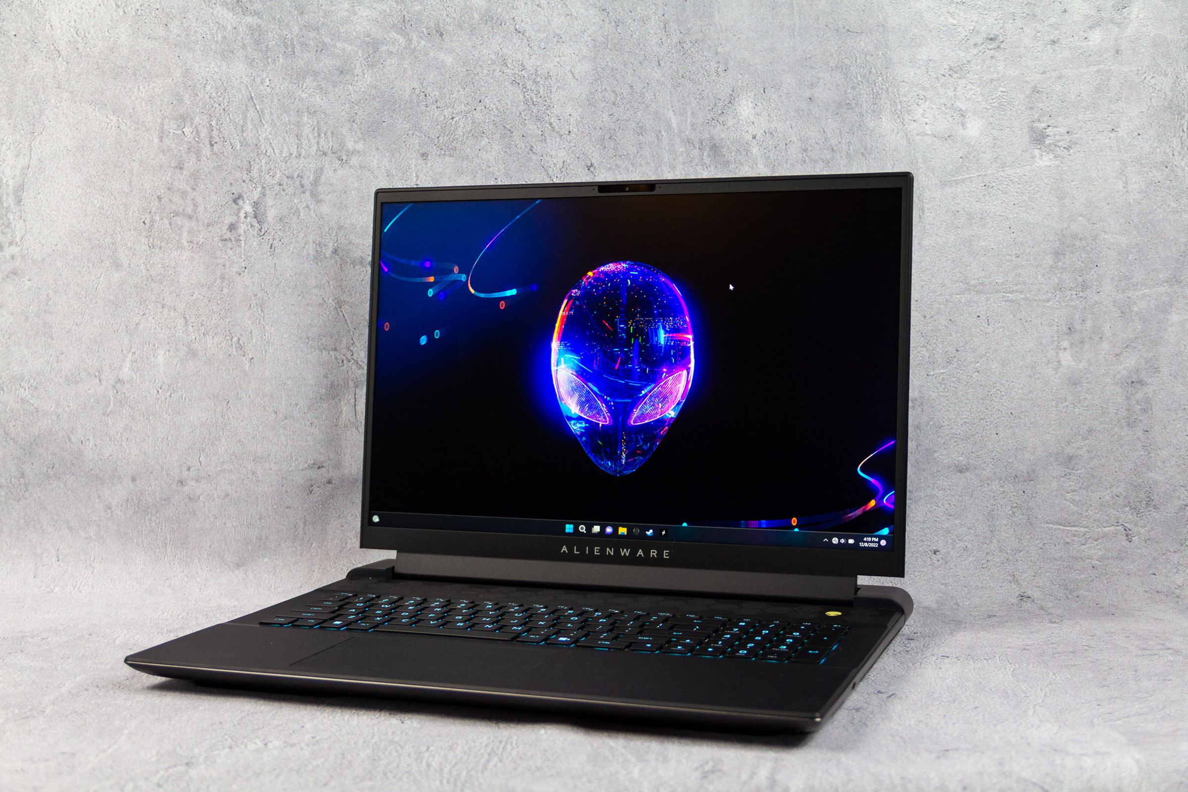 The Alienware M18 gaming laptop with its display showing the Alienware logo.