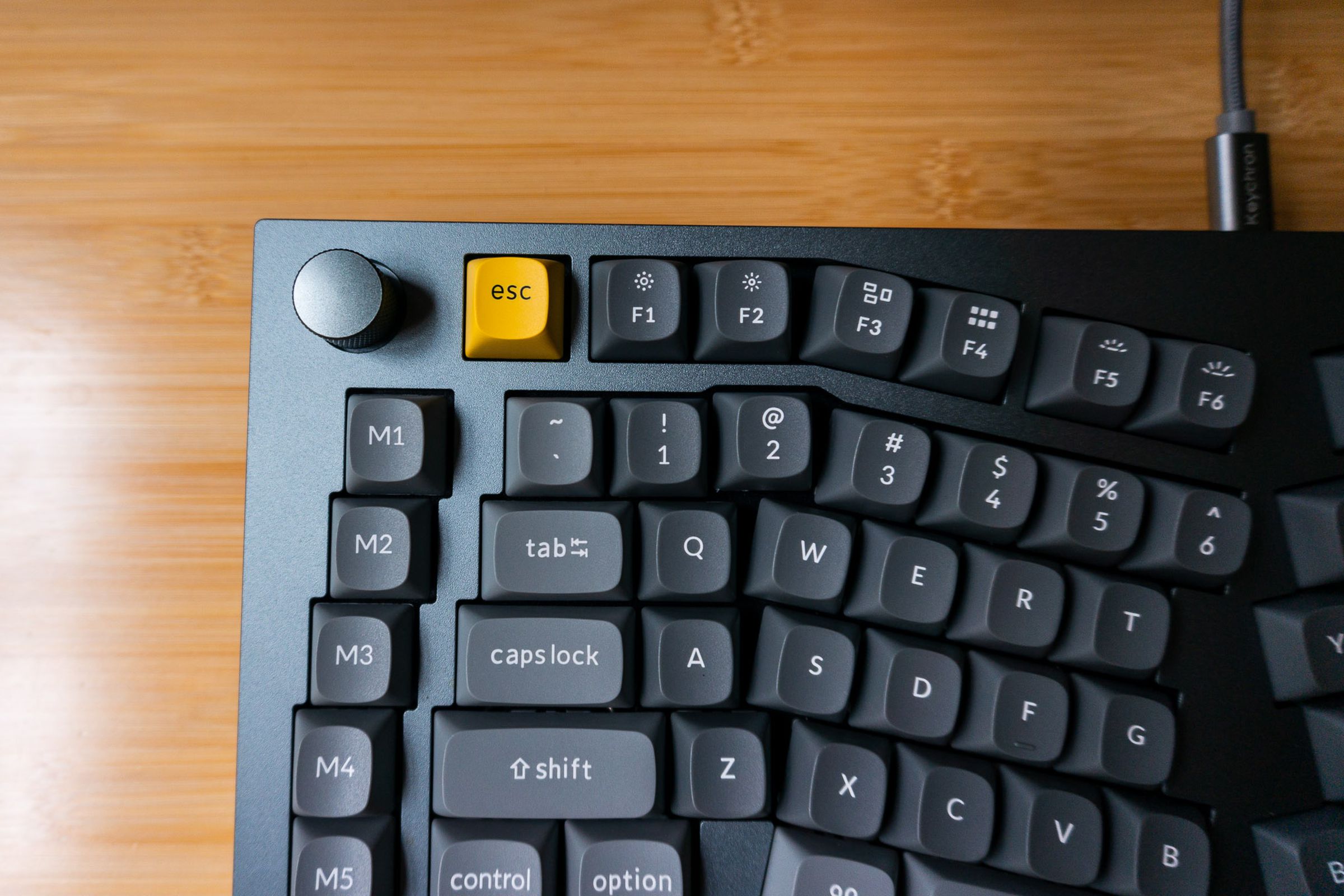 Close-up of left-hand side of Keychron Q10, showing the left-hand modifiers. The legends for Tab, Caps Lock, and Shift are vertically misaligned and oddly kerned.
