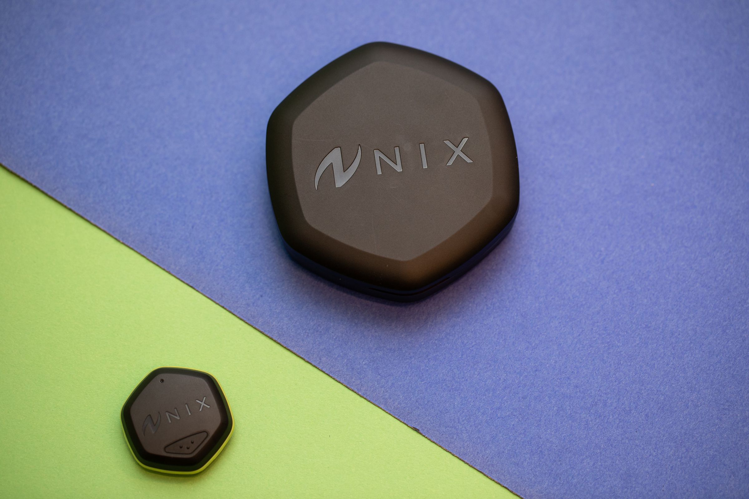 Picture of Nix charging case and sensor pod side by side.