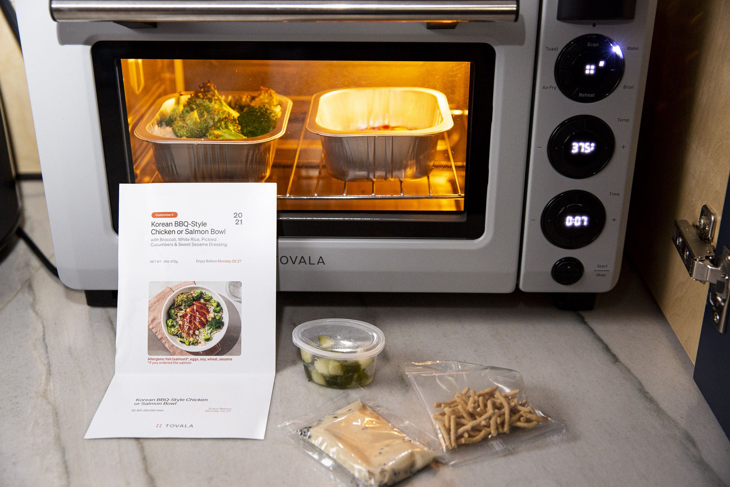 You cook all the parts of the Tovala meal kit at the same time by just scanning a QR code and pressing start.