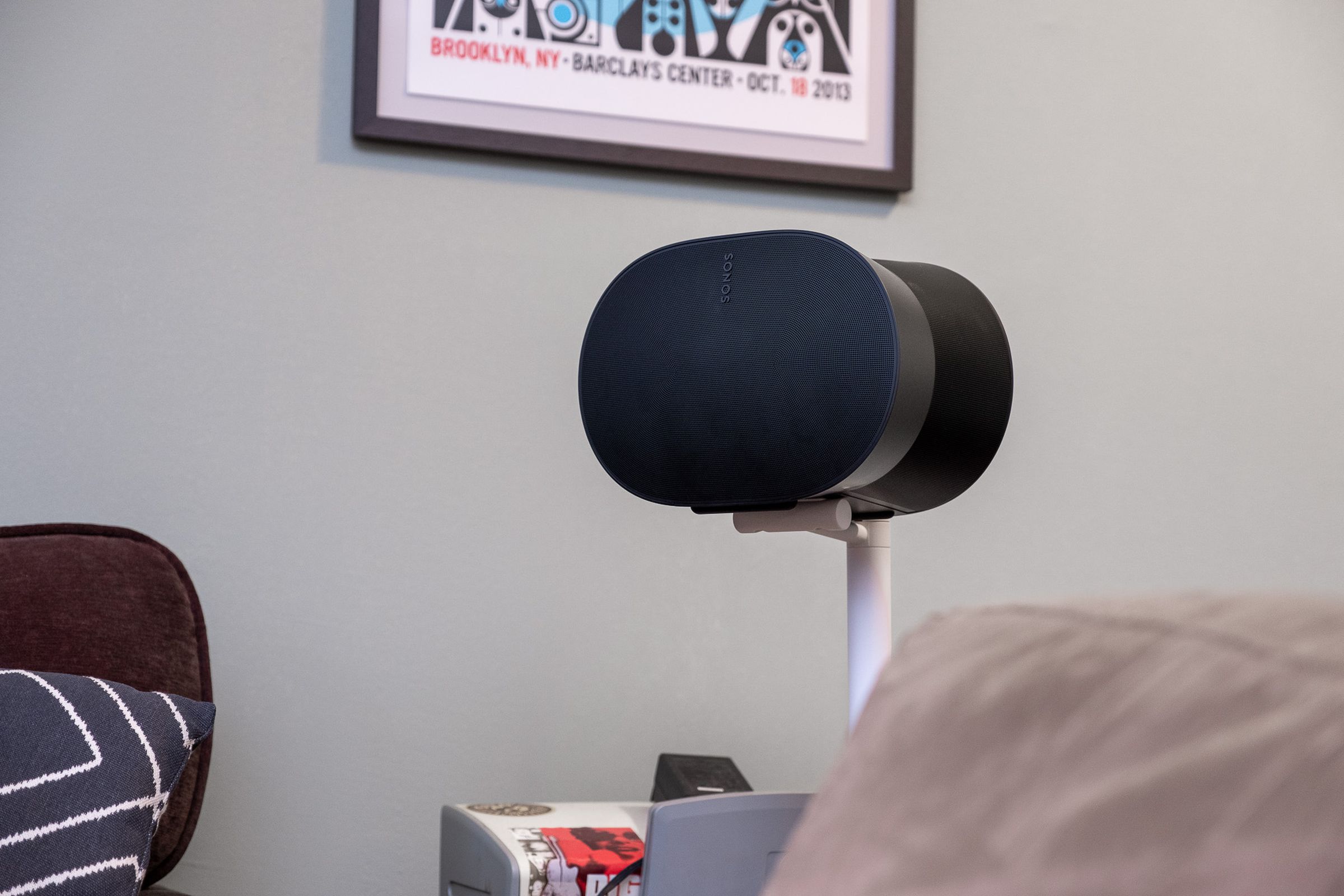 A photo of the Sonos Era 300 speaker attached to a floor stand.