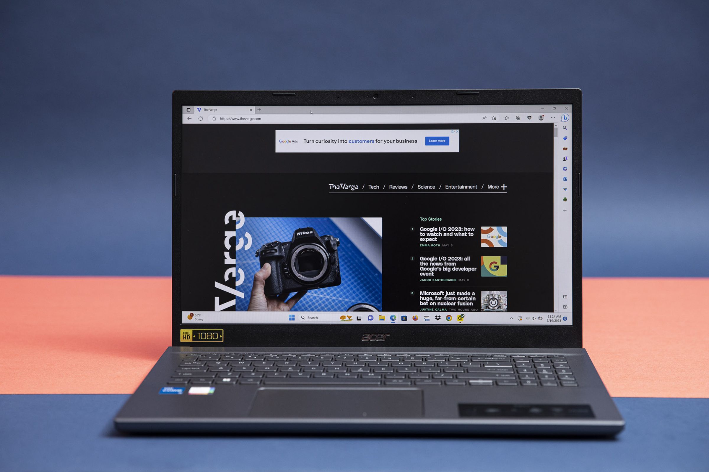 The Acer Aspire 5 displaying The Verge homepage.