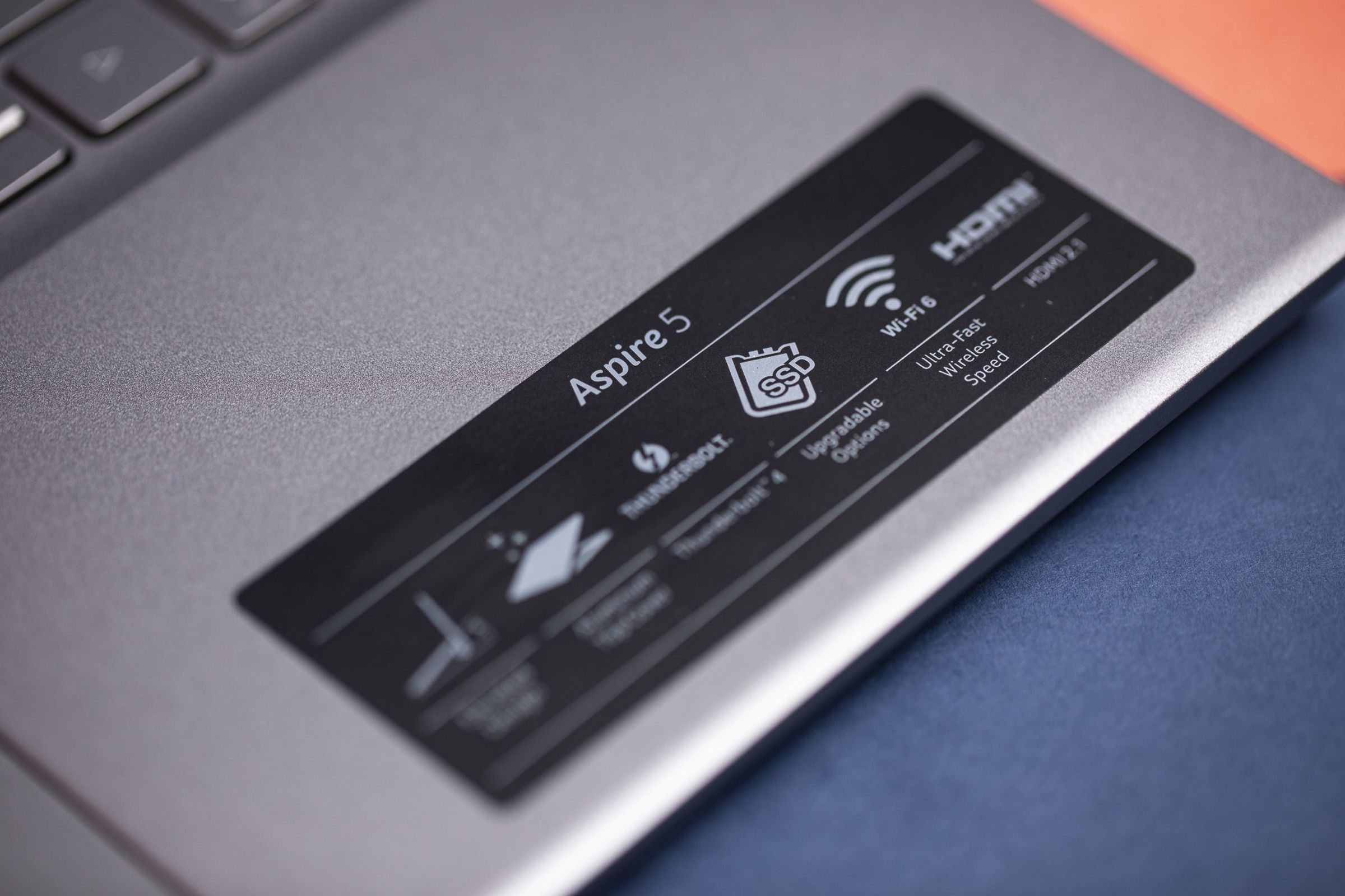 The sticker on the right palm rest of the Acer Aspire 5. Visible text reads SSD Upgradable Options and Wi-Fi 6 ultra-fast wireless speed.