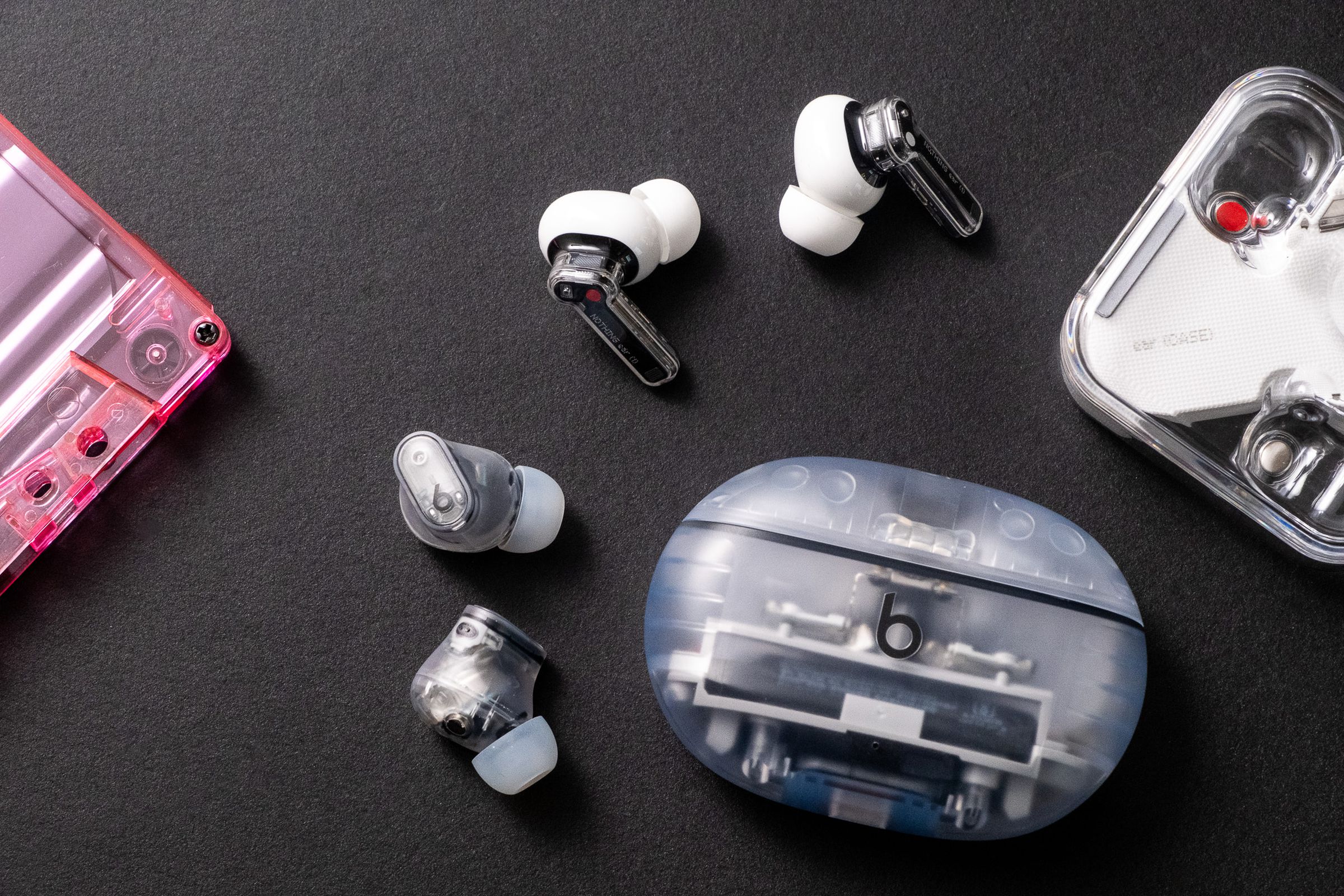 A photo of Beats’ translucent Studio Buds Plus earbuds.