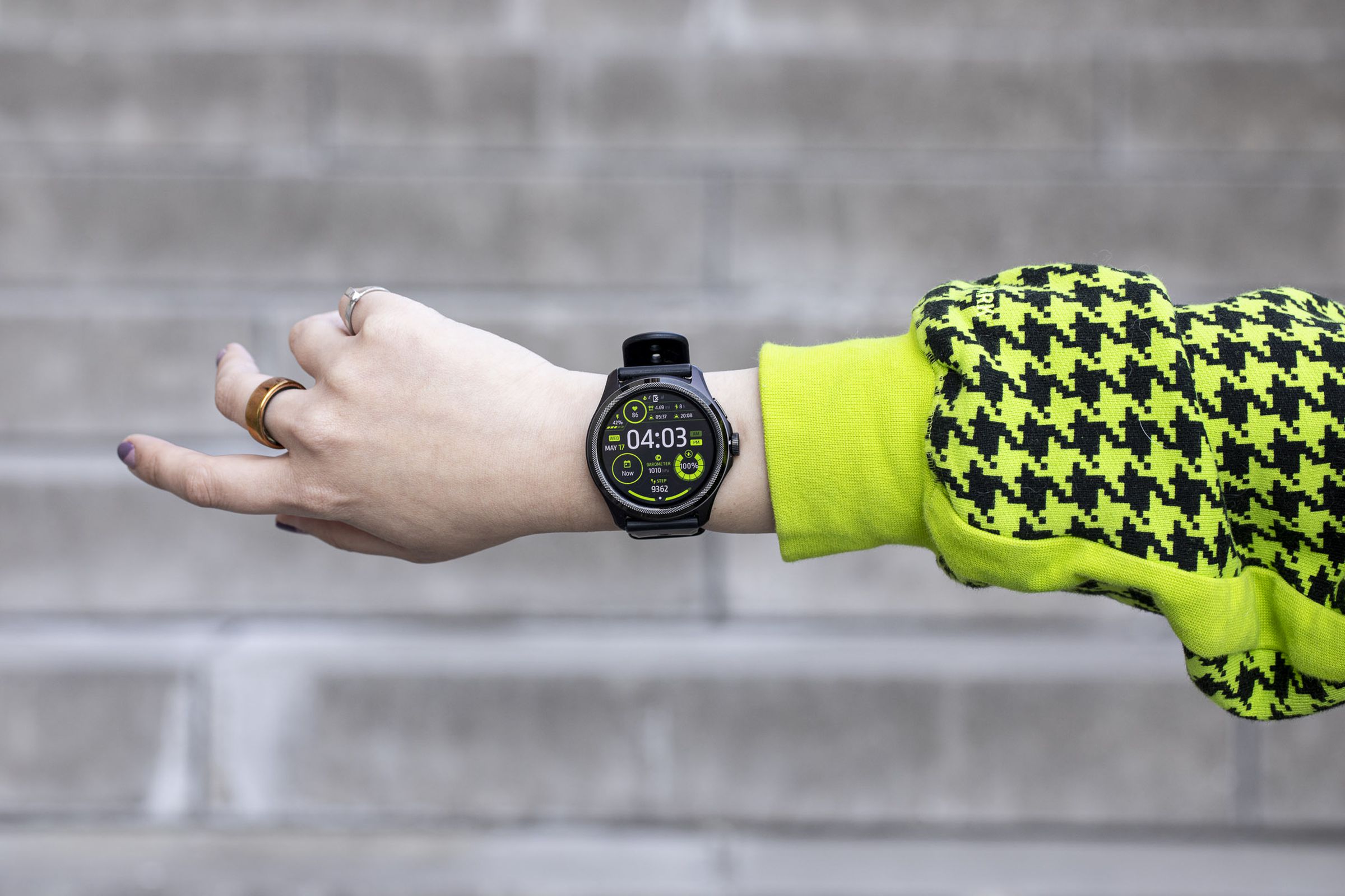 Person holding outstretched arm showing TicWatch Pro 5.