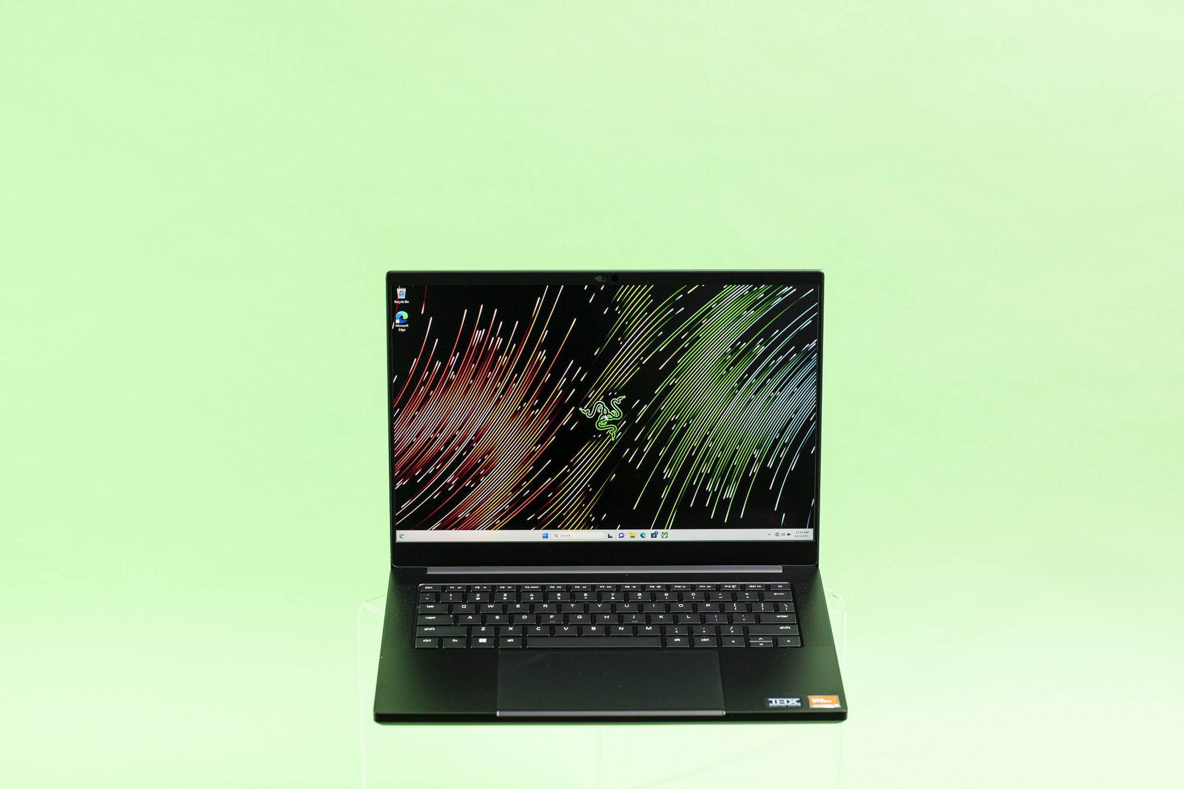 Razer Blade 14 seen from the front on a green background.