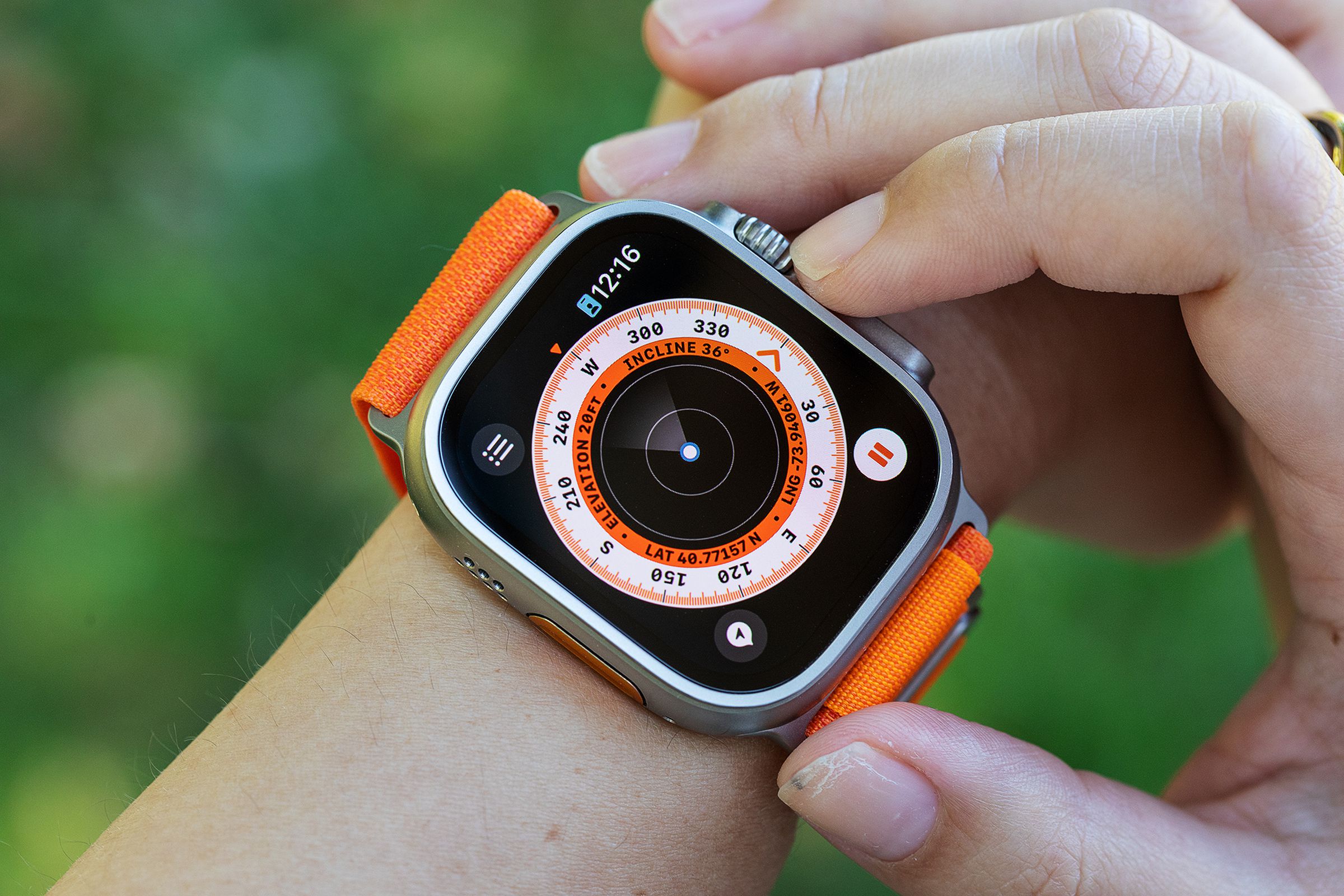 Apple Watch Ultra with compass watchface on a person’s wrist
