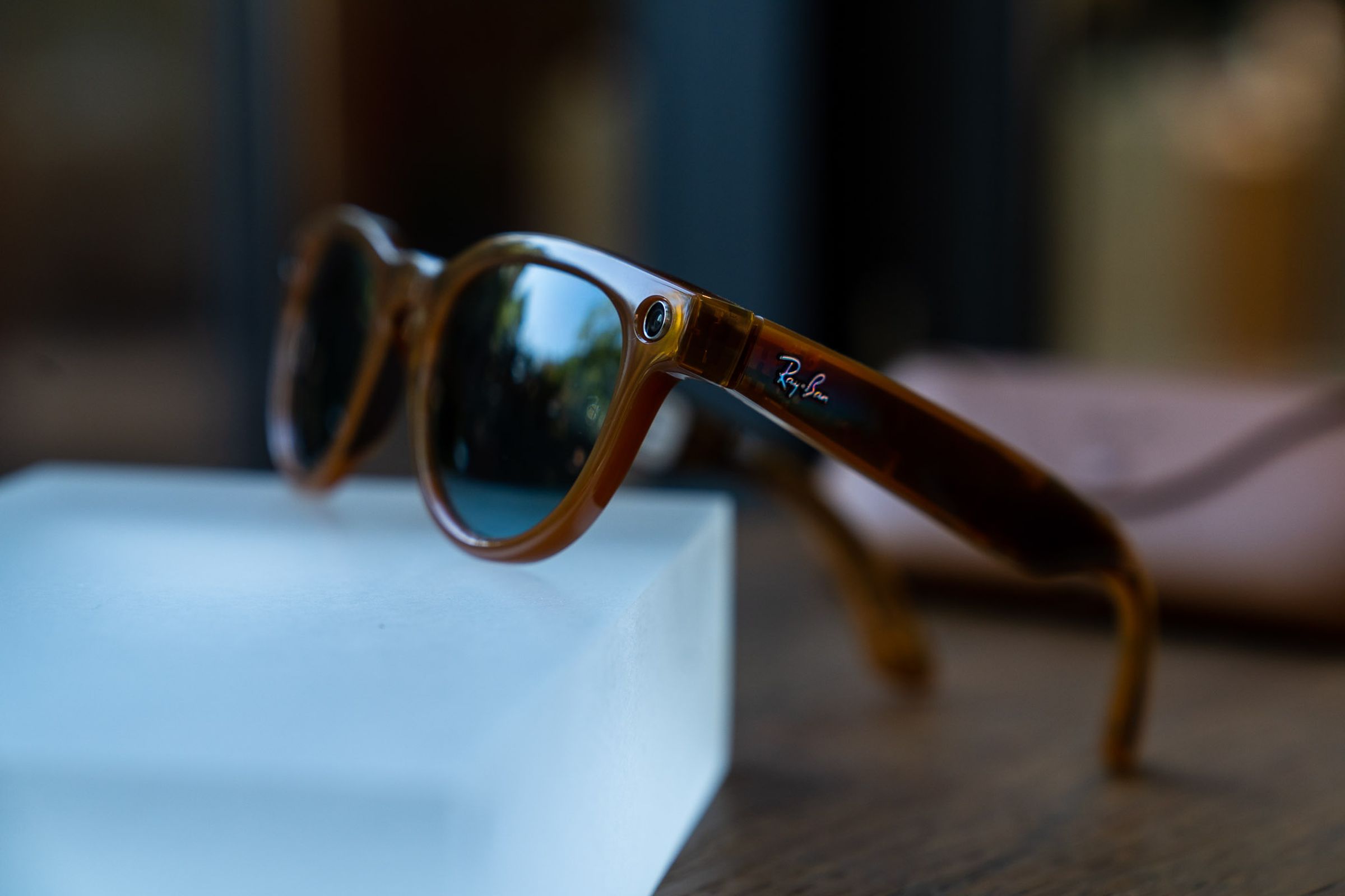 Ray-Ban Meta Smart Glasses propped up on a glass block