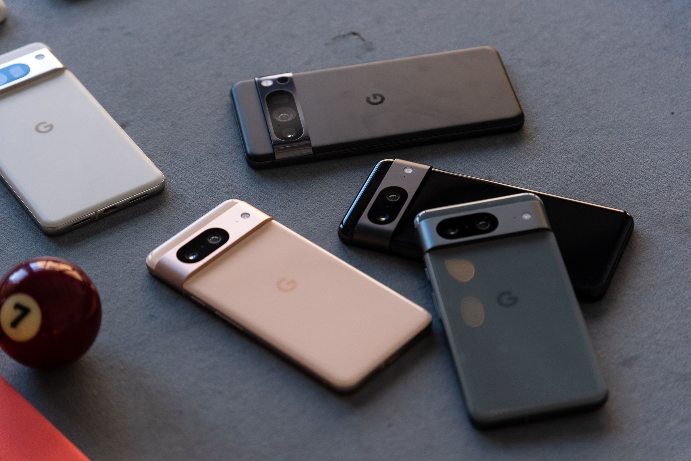 A pile of five Pixel 8 devices.