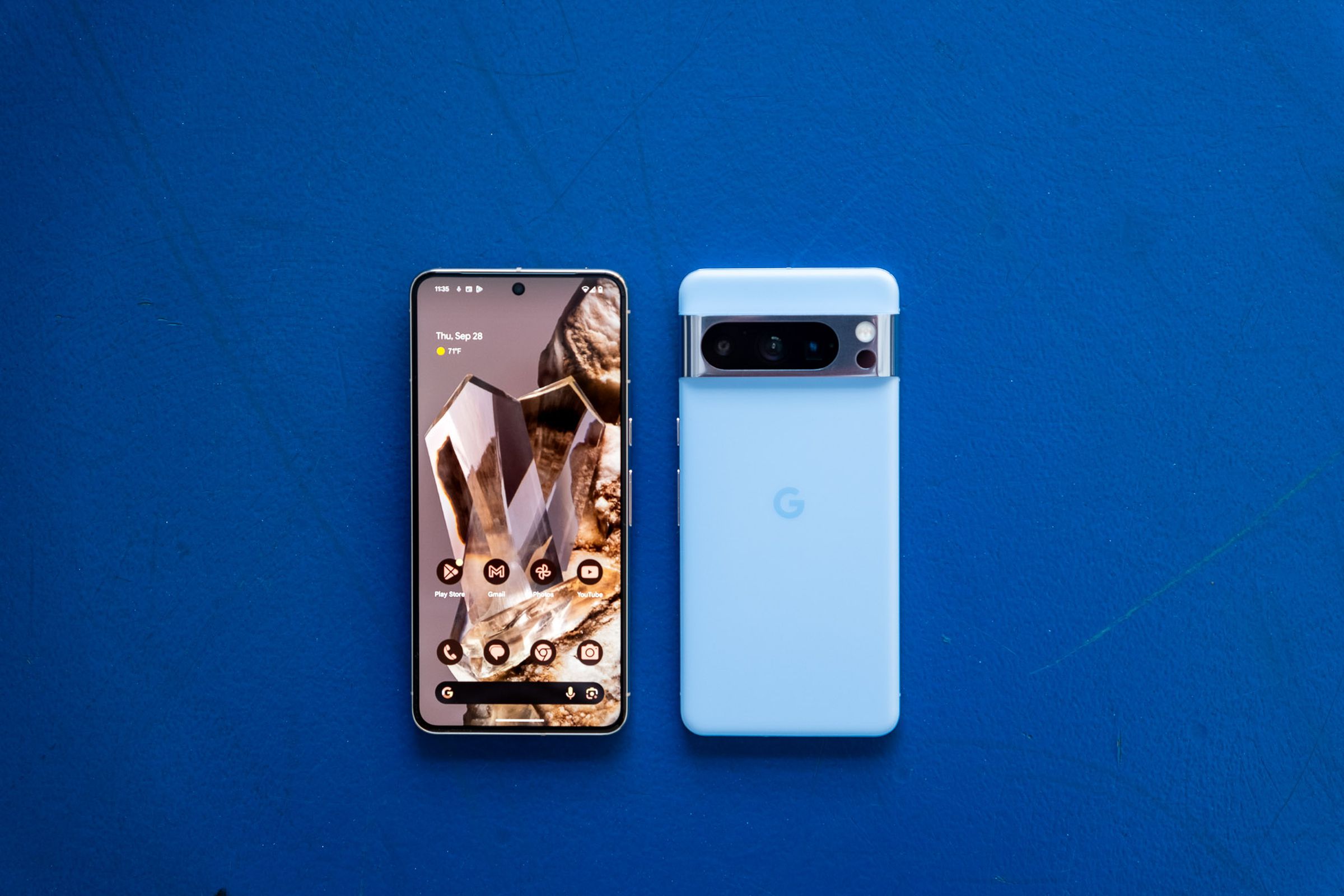 Bay blue Pixel 8 Pro showing front and back on a blue background.