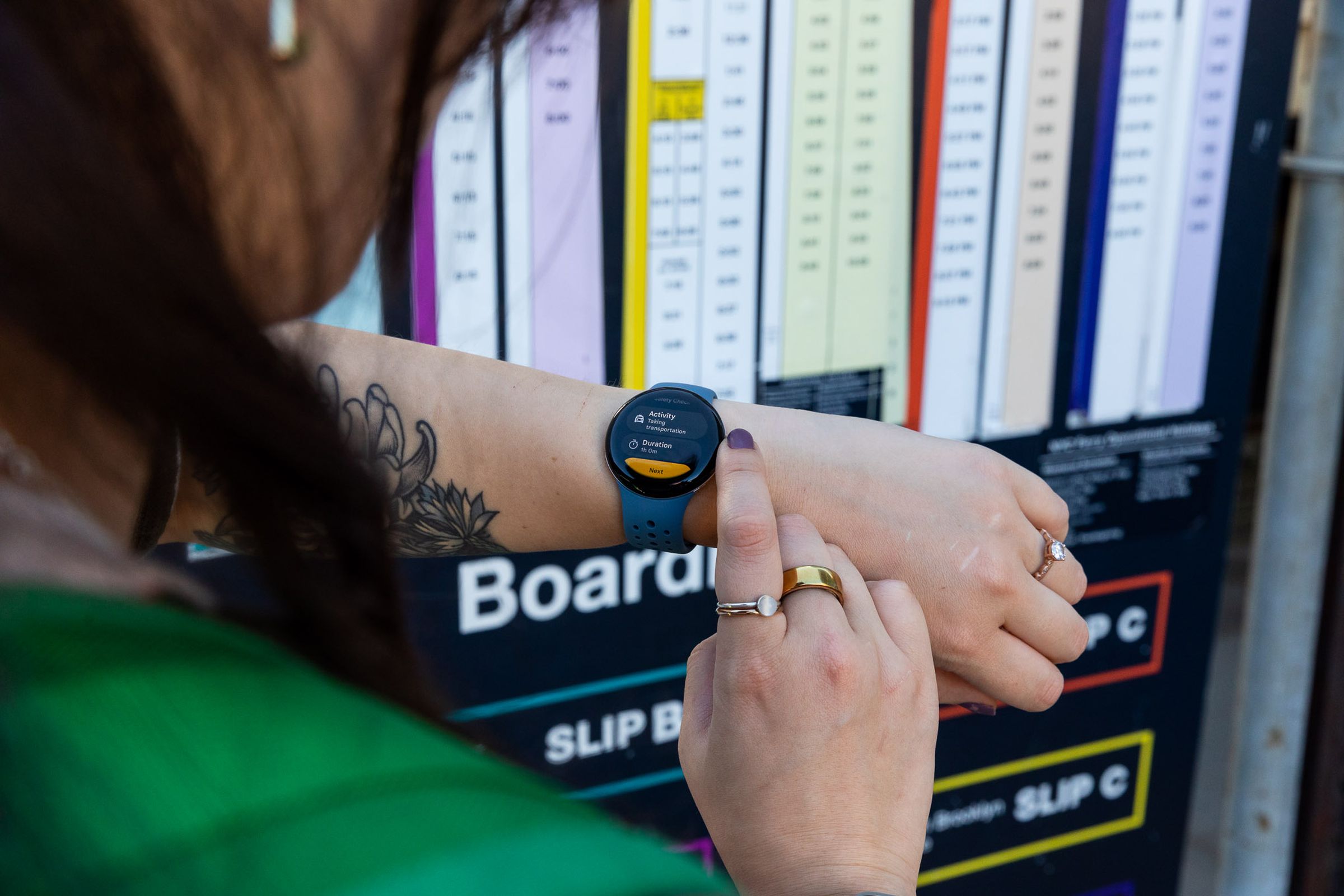 Person initiating safety check on the Pixel Watch 2 at a ferry pier