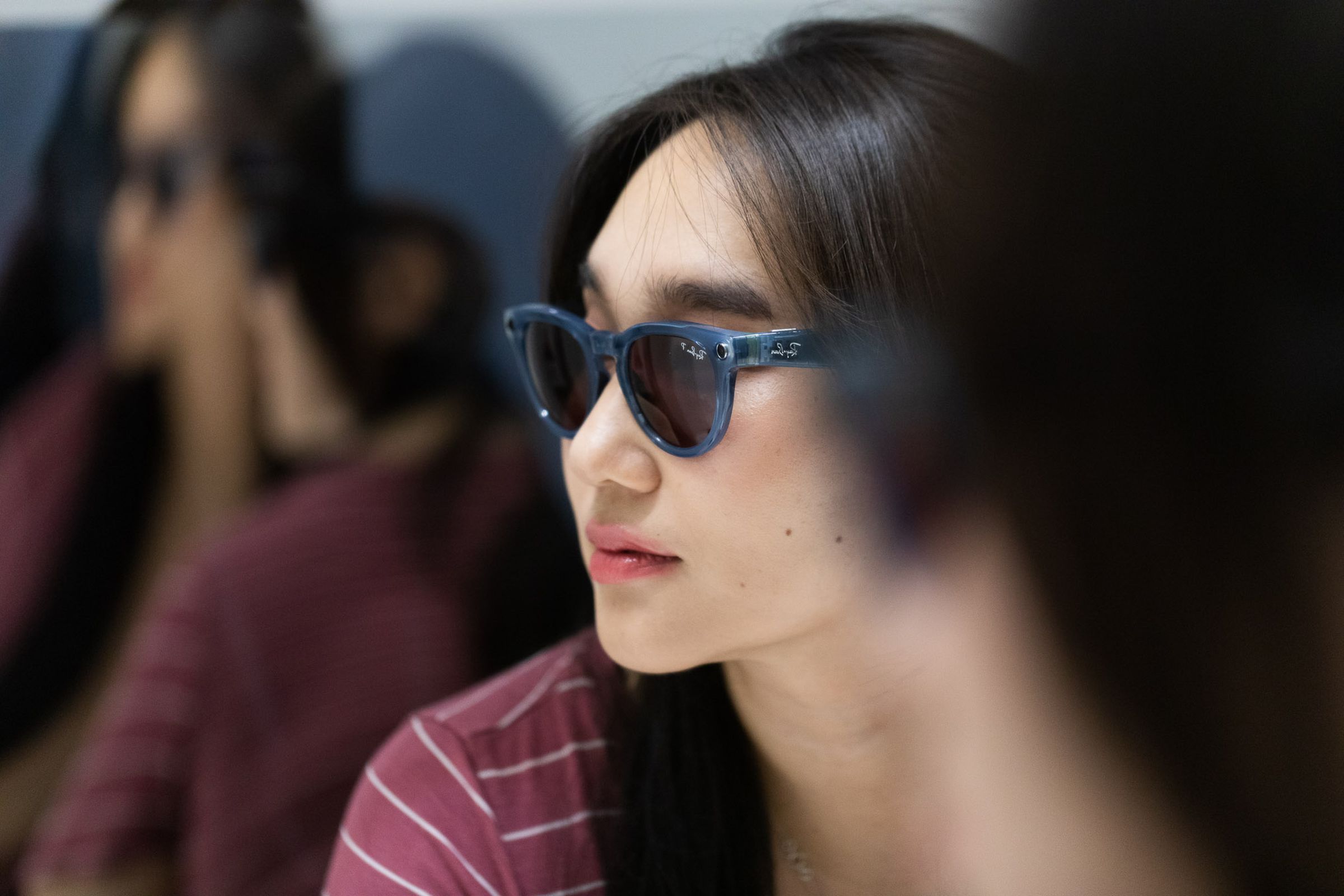 Person wearing Ray-Ban Meta Smart Glasses in front of a mirror creating an uneasy infinity effect 
