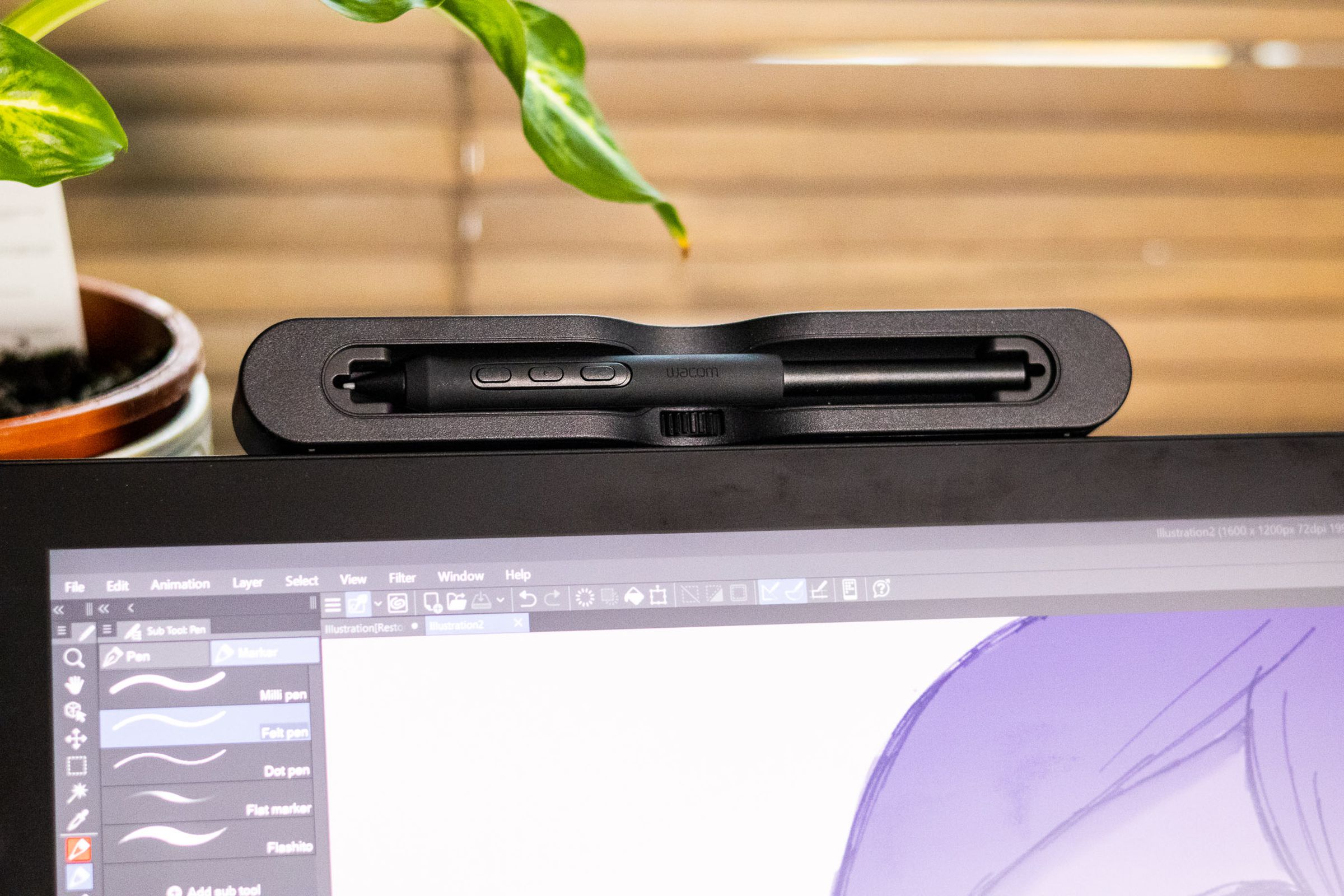 The Wacom Cintiq Pro 27 stylus holder attached to the top of the tablet.