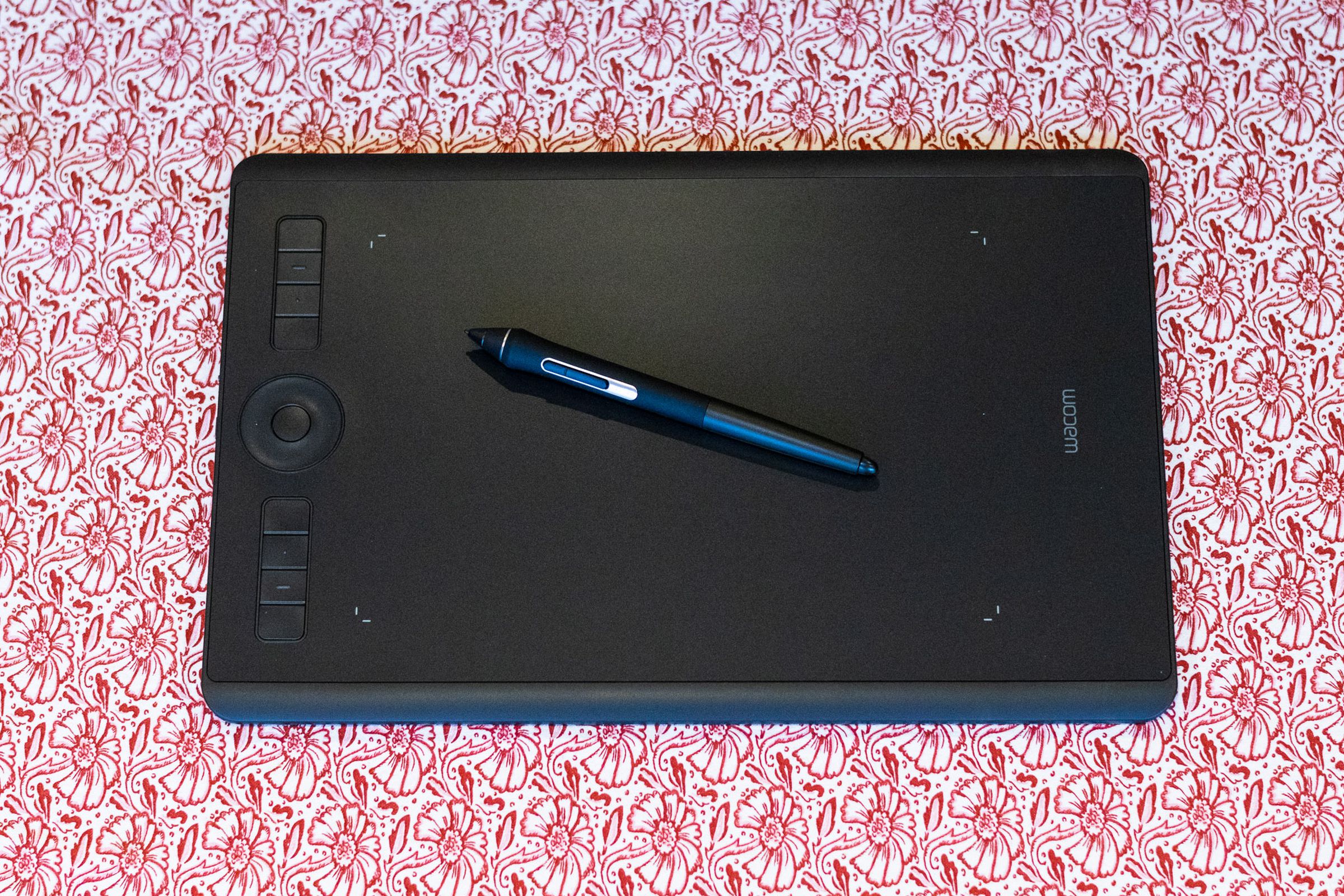 The Wacom Intuos Pro (Medium) resting against a table.